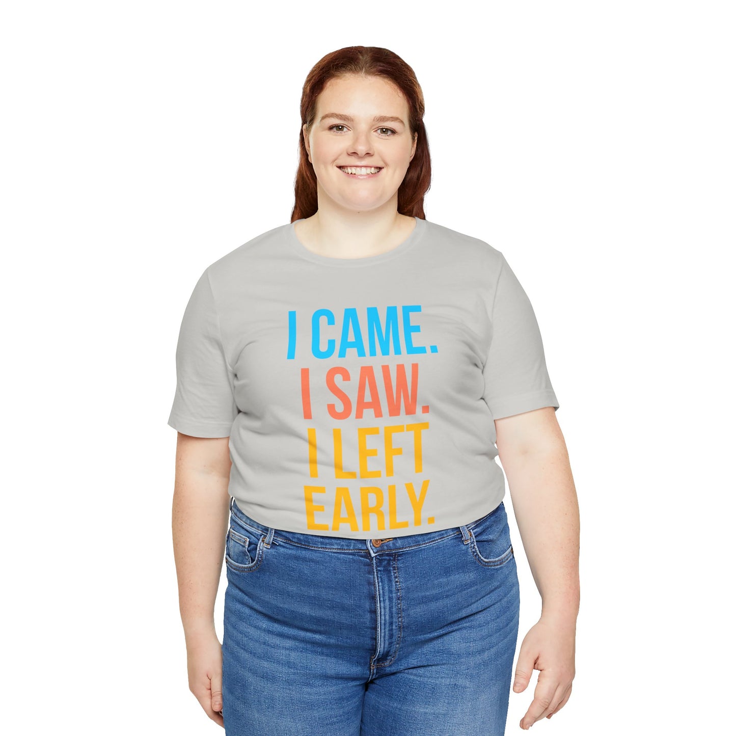 Person wearing a gray t-shirt with colorful text 'I CAME. I SAW. I LEFT EARLY.' on a white background