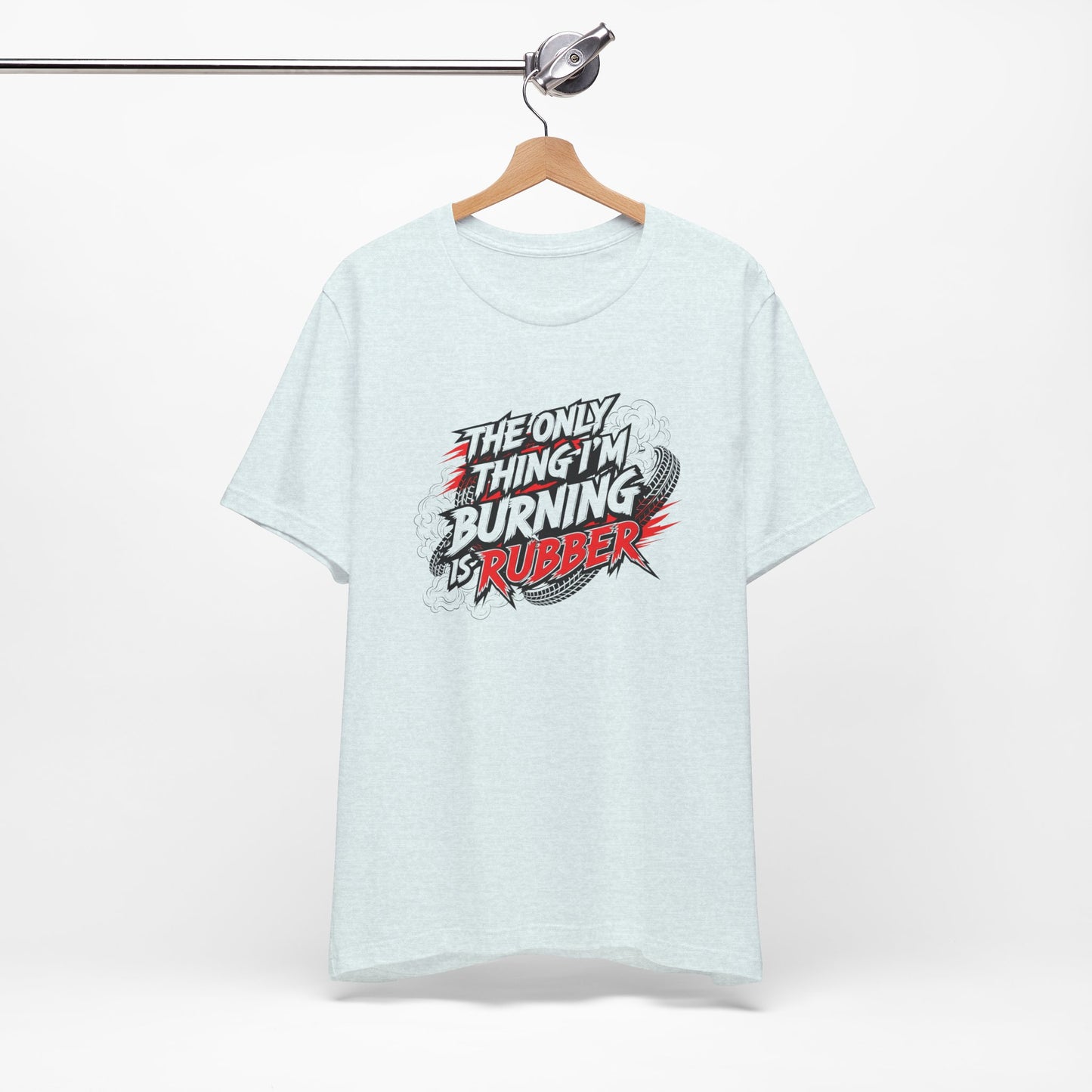 Light blue t-shirt with graphic text 'The only thing I'm burning is rubber' on a white background