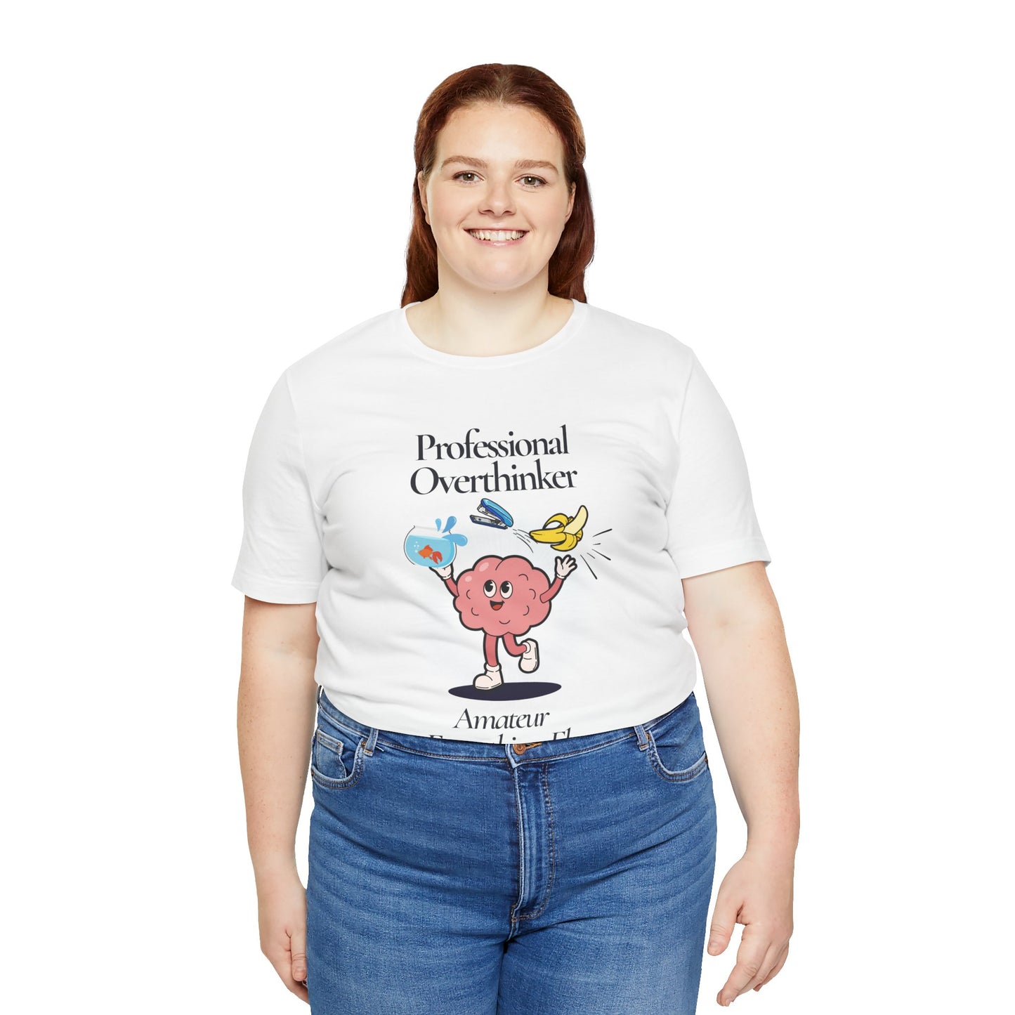 Person wearing a white t-shirt with a graphic and text 'Professional Overthinker, Amateur Everything Else', standing against a white background
