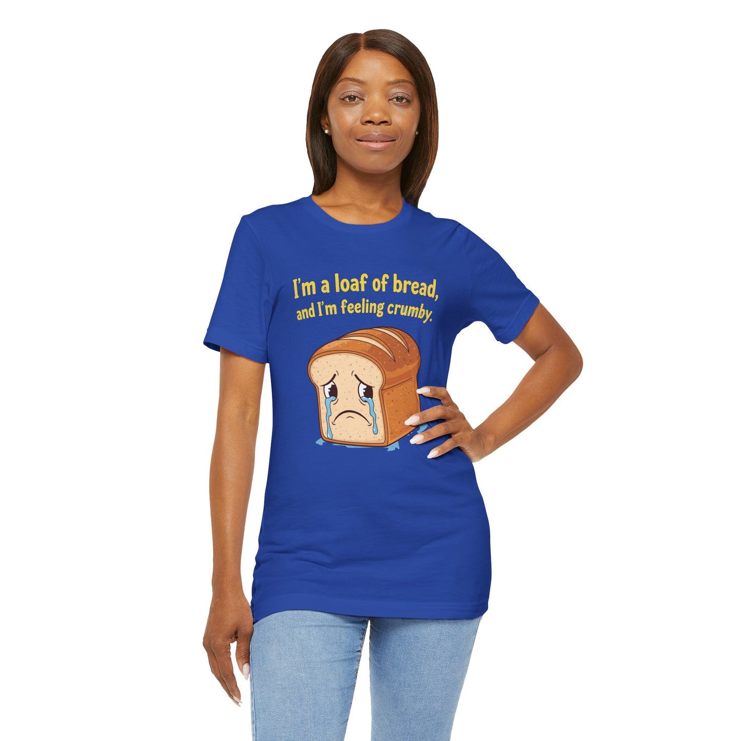 Woman wearing a blue t-shirt with a bread graphic and text on a white background. Text says, 'I'm a loaf of bread, and I'm feeling crumby'