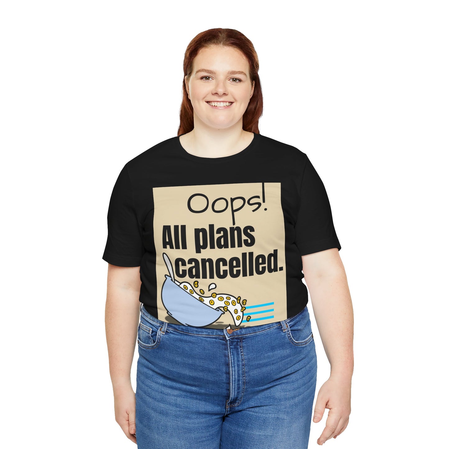Person wearing a black t-shirt with a graphic and text 'Oops! All plans cancelled.'