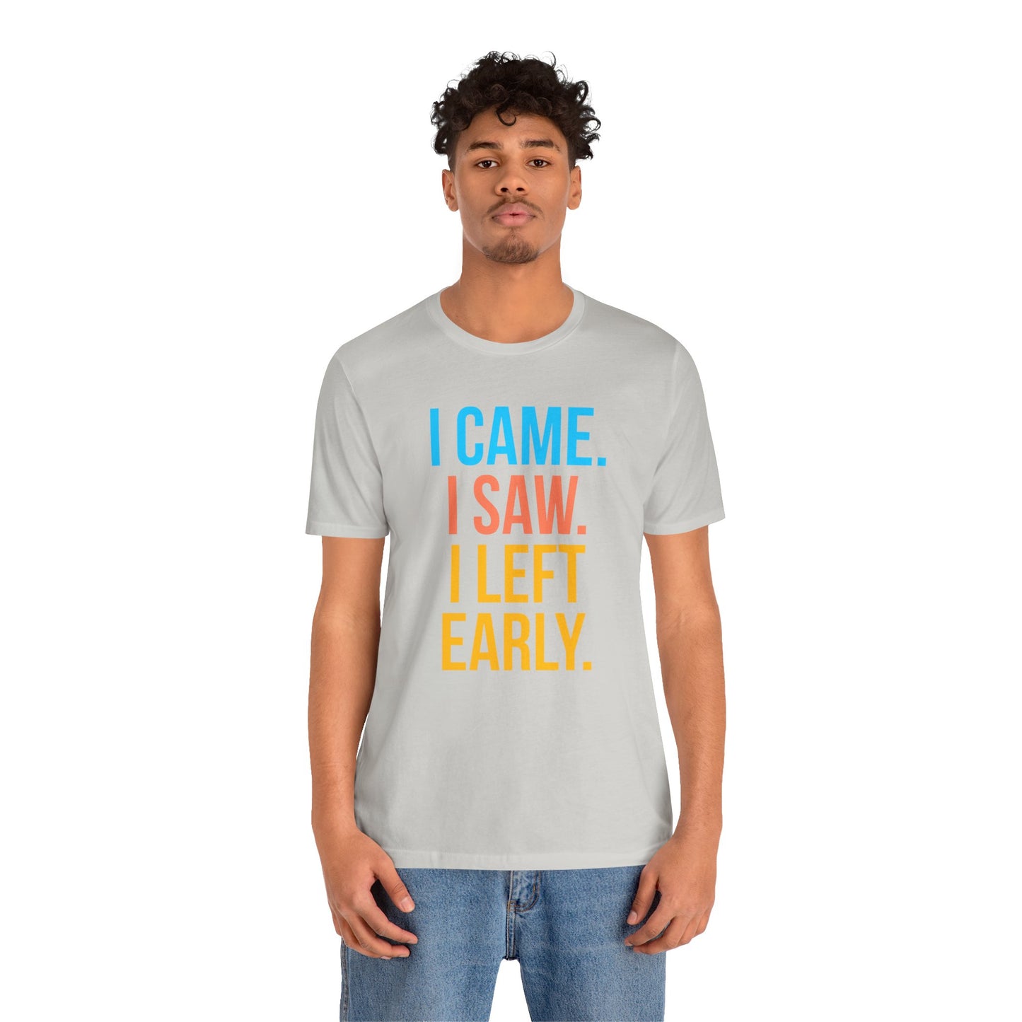 Person wearing a gray t-shirt with colorful text 'I CAME. I SAW. I LEFT EARLY.' on a white background