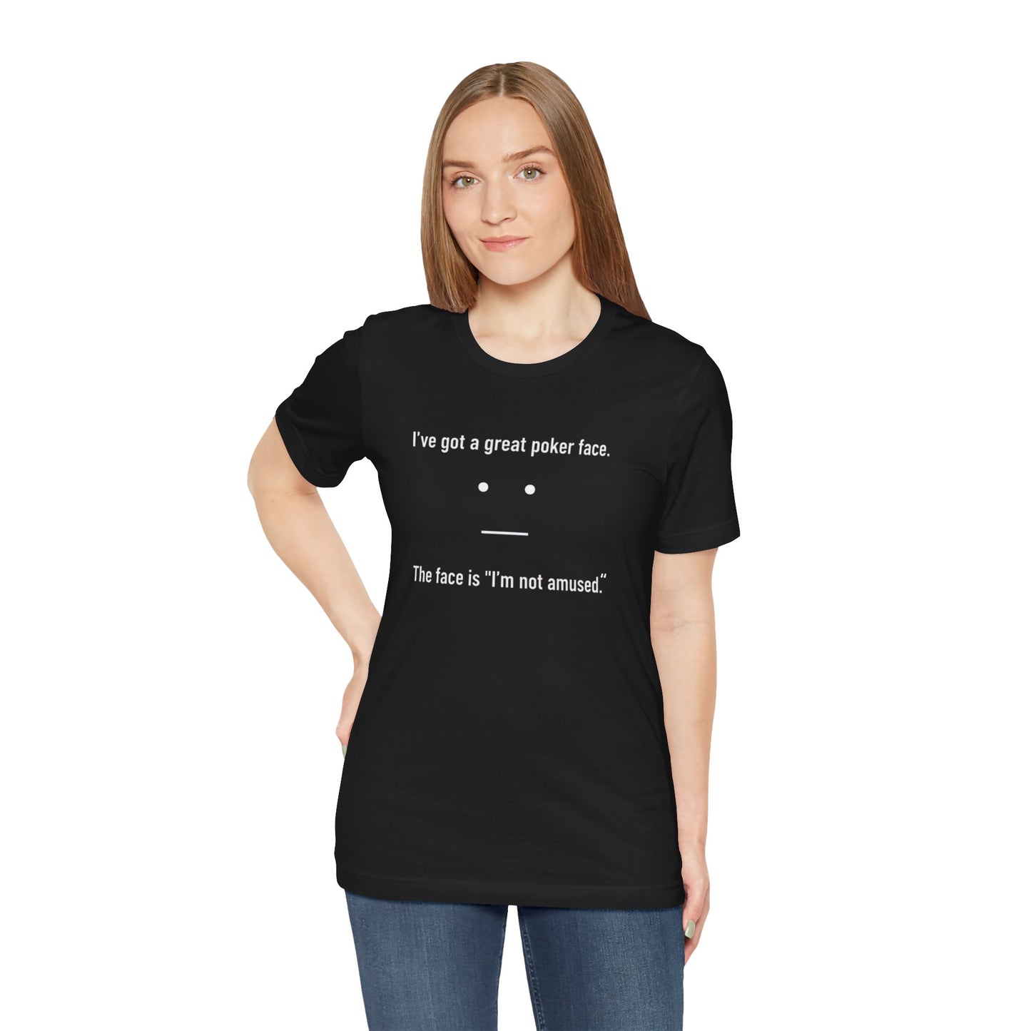 Person wearing a black t-shirt with text 'I've got a great poker face. The face is I'm not amused.' and a face graphic on a white background