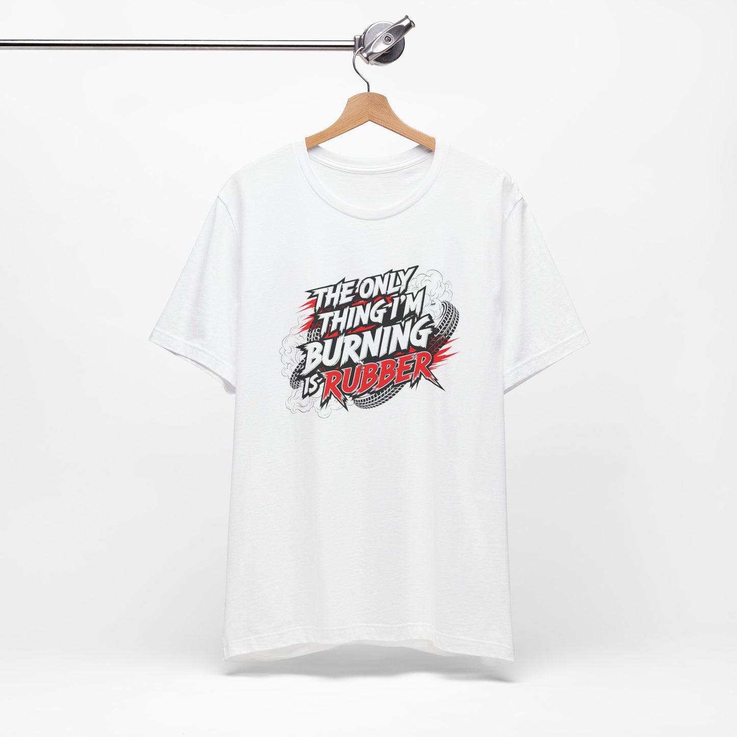 White t-shirt with graphic design and text 'The only thing I'm burning is rubber' on a white background