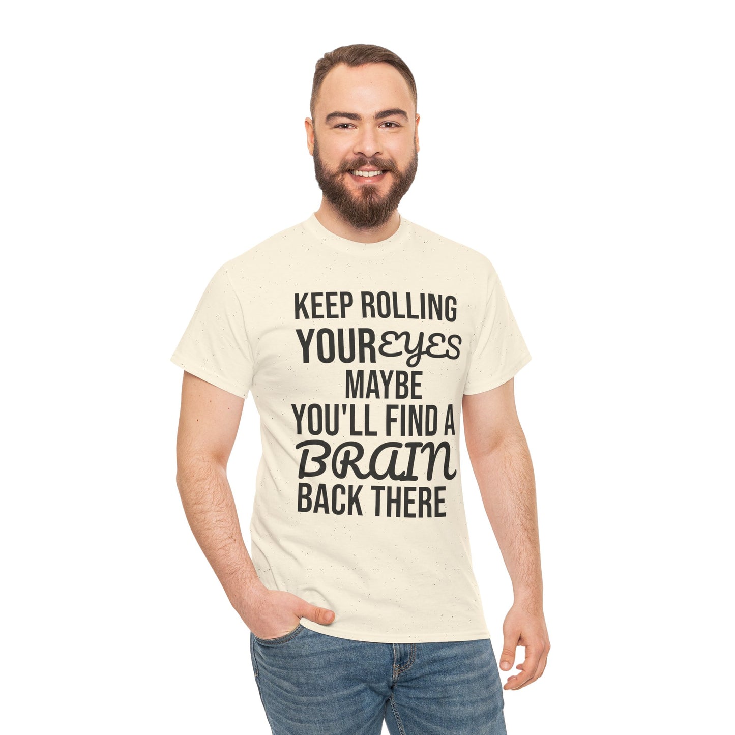 Man wearing a cream t-shirt with humorous text 'KEEP ROLLING YOUR EYES MAYBE YOU'LL FIND A BRAIN BACK THERE' design on a white background