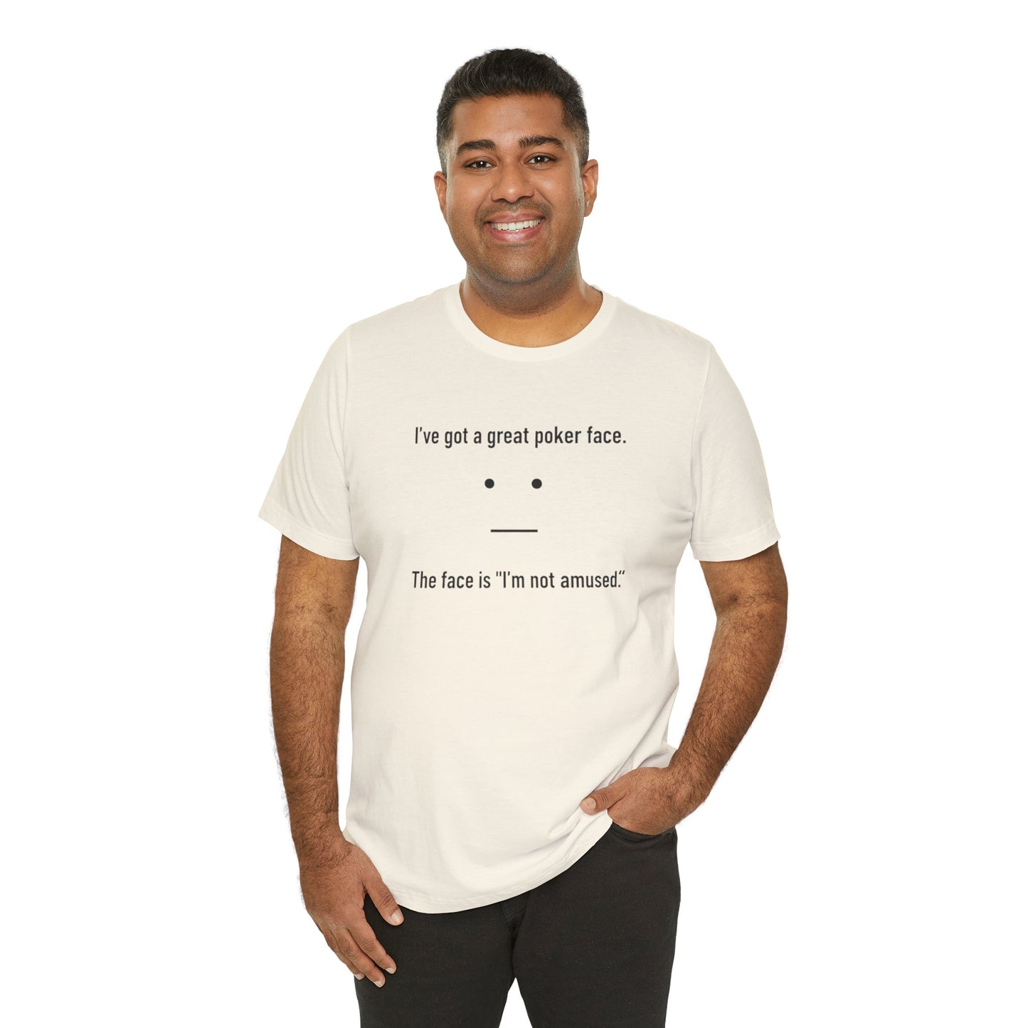 Man wearing a natural t-shirt with text 'I've got a great poker face. The face is I'm not amused.' and a face graphic on a white background