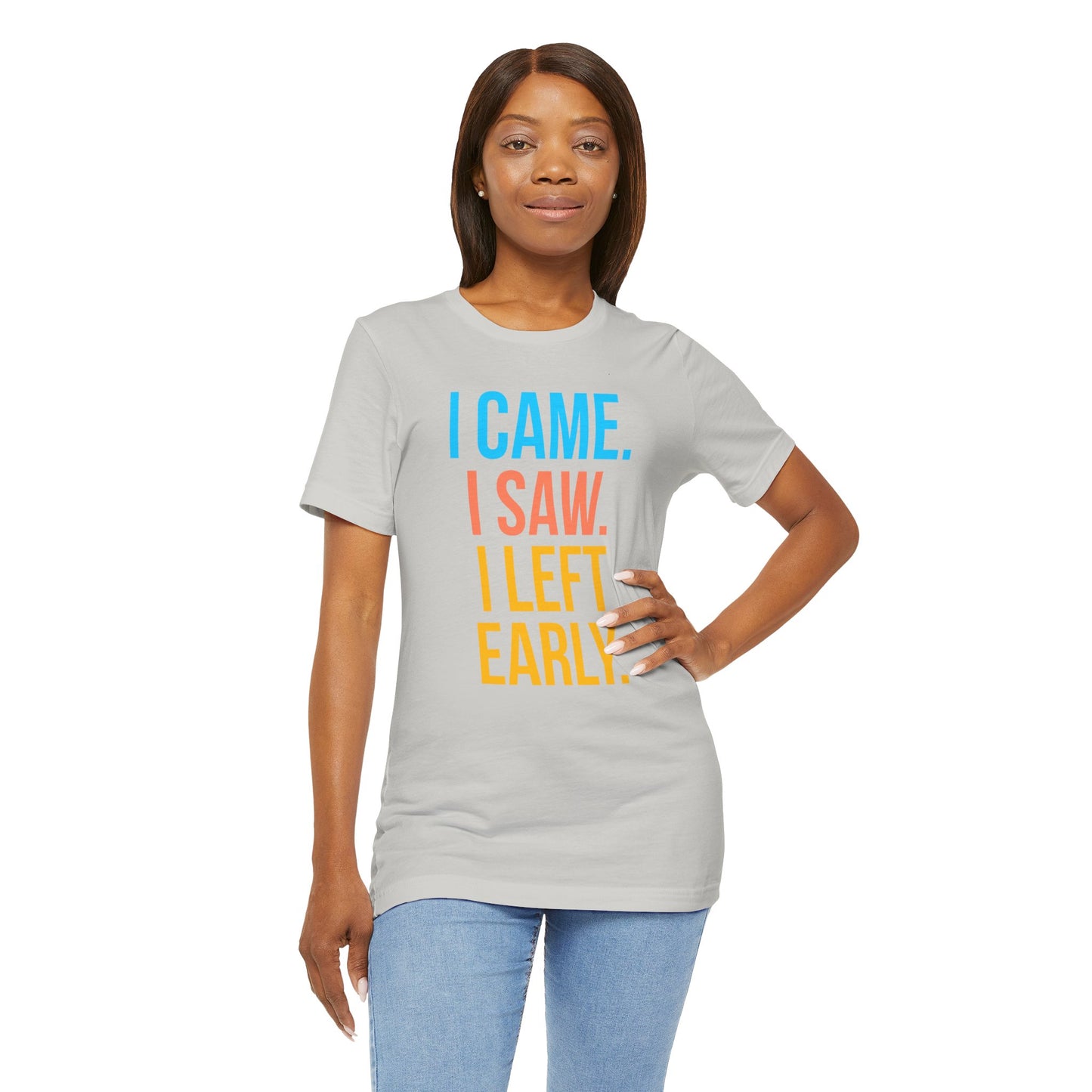 Woman wearing a gray t-shirt with colorful text 'I CAME. I SAW. I LEFT EARLY.' on a white background