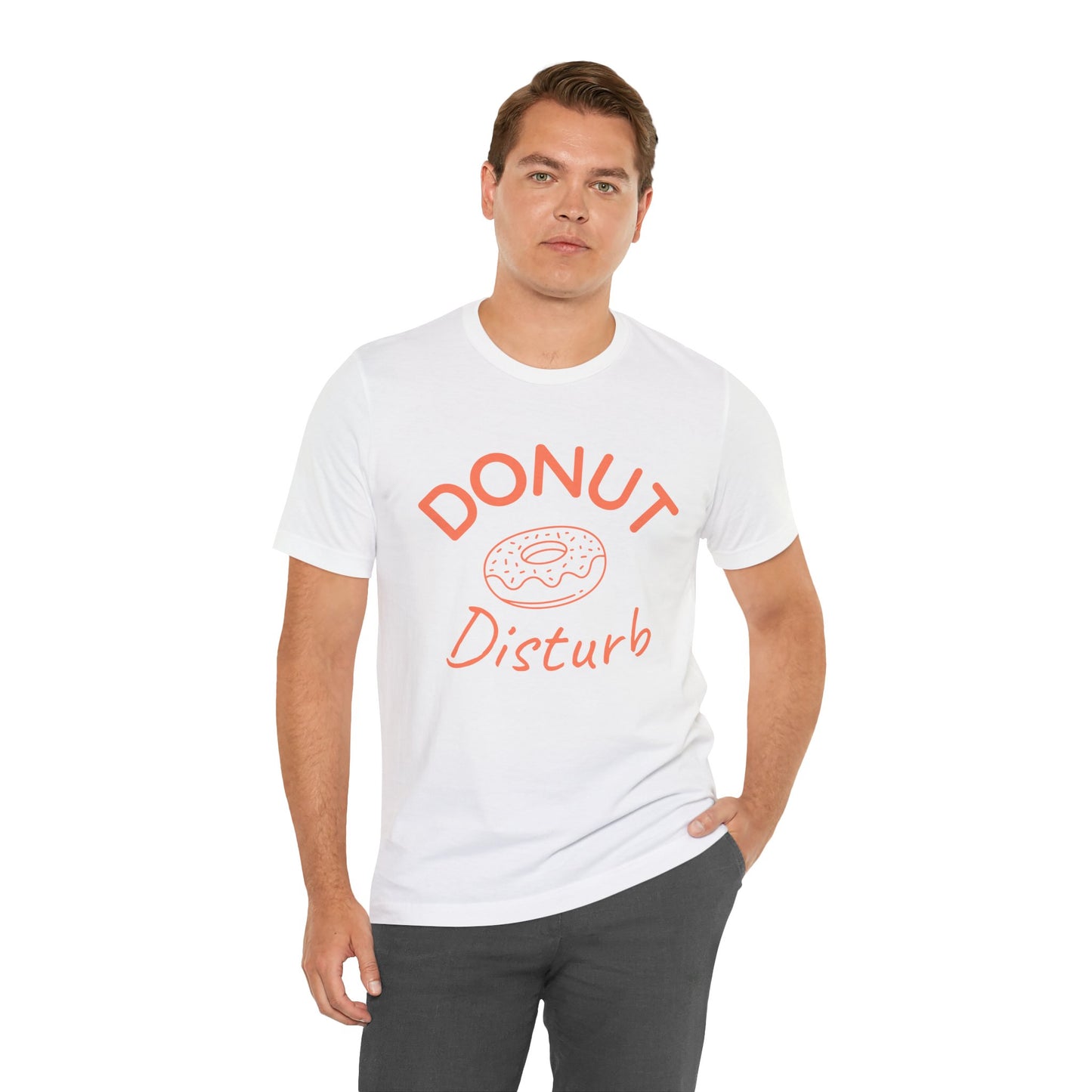 Man wearing a white t-shirt with 'DONUT Disturb' text and donut graphic on a white background