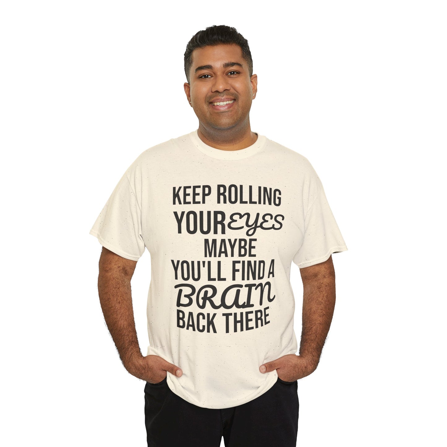 Man wearing a cream t-shirt with humorous text 'KEEP ROLLING YOUR EYES MAYBE YOU'LL FIND A BRAIN BACK THERE' design on a white background