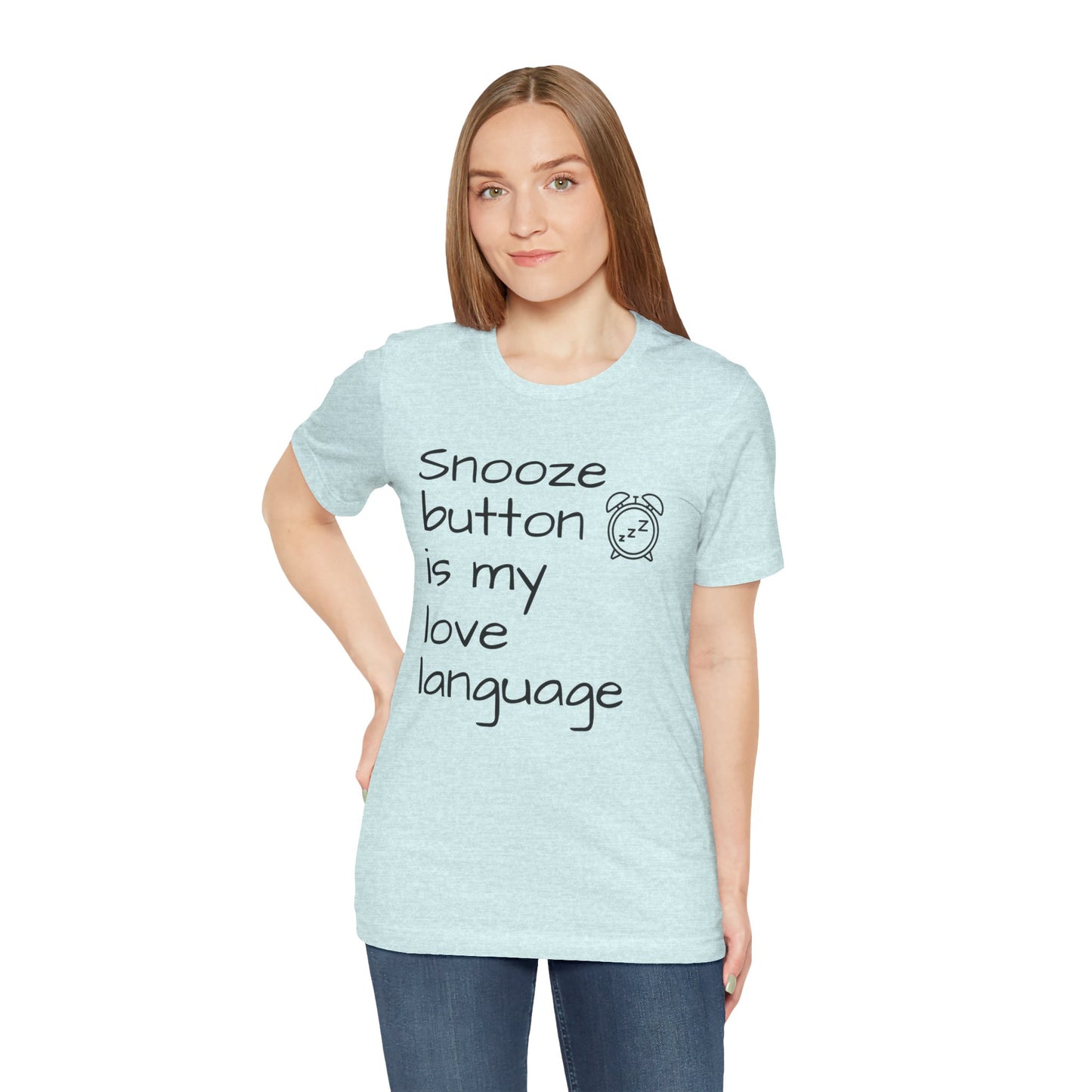 Woman wearing a light blue t-shirt with text 'Snooze button is my love language' on a white background