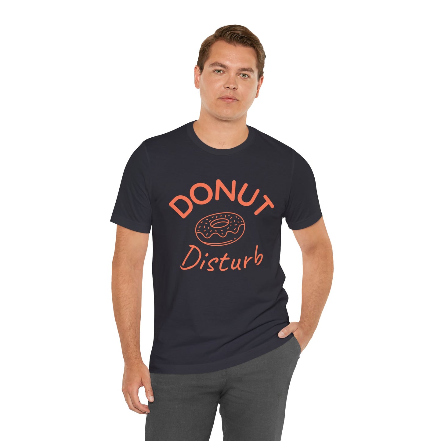 Man wearing a black t-shirt with 'DONUT Disturb' text on a white background