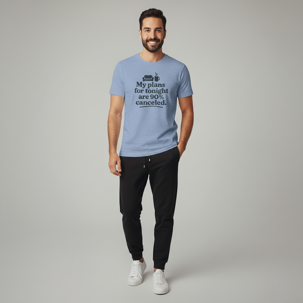 Man wearing a light blue t-shirt with text 'My plans for tonight are 90% canceled' on a plain background