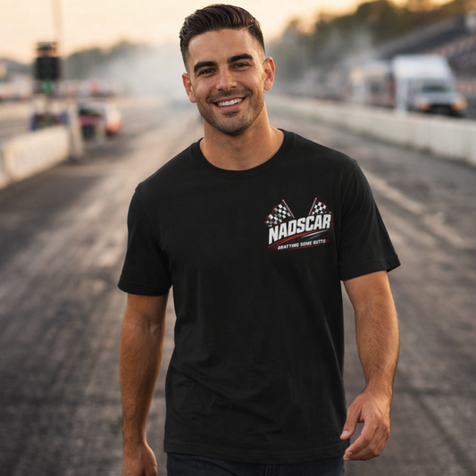 Man wearing a black NADSCAR t-shirt on a race track