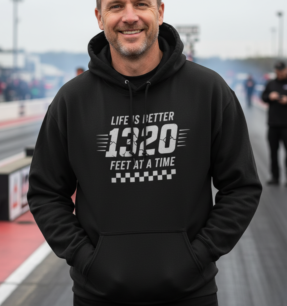 Man wearing a black hoodie with text 'Life is better 1320 feet at a time' on a track background