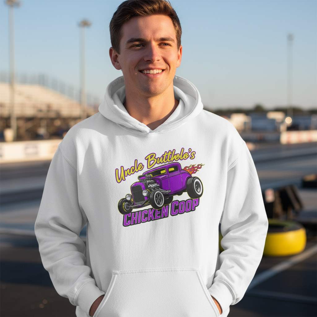 Person wearing a white hoodie with a graphic design of a purple car and text 'Uncle Butthole's Chicken Coop', standing in an outdoor setting.