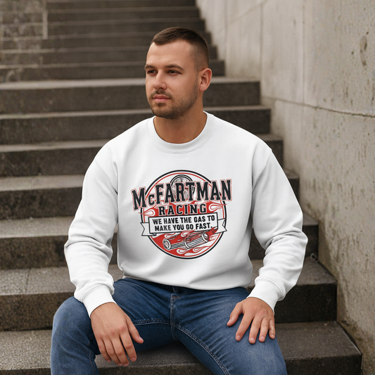 Man wearing a white sweatshirt with 'McFartman Racing' design sitting on steps.