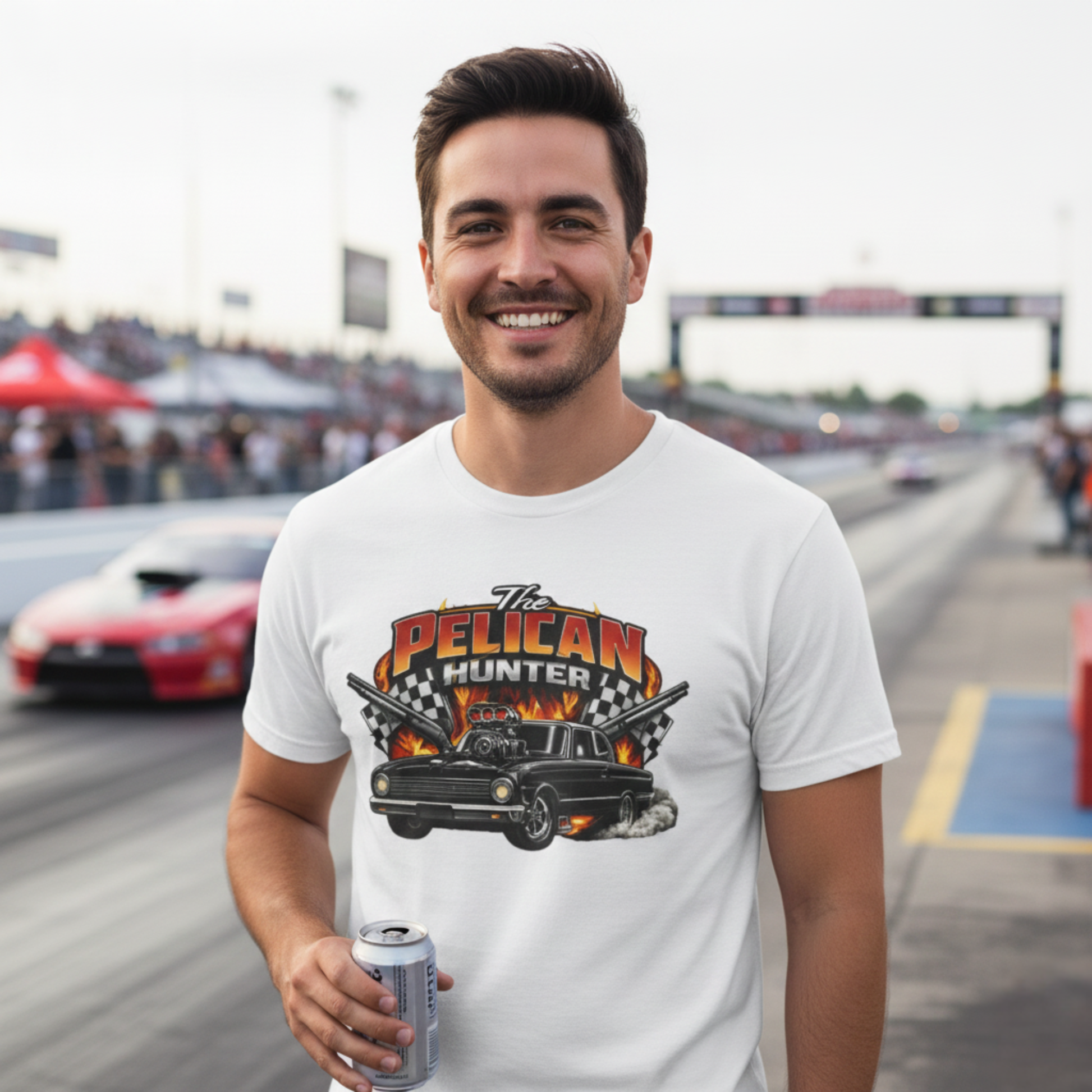 Man wearing a 'Pelican Hunter' t-shirt on a race track