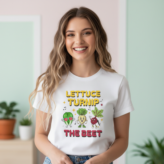 Woman wearing a white t-shirt with vegetable-themed design and text 'Lettuce Turnip the Beet', standing in a room with plants.