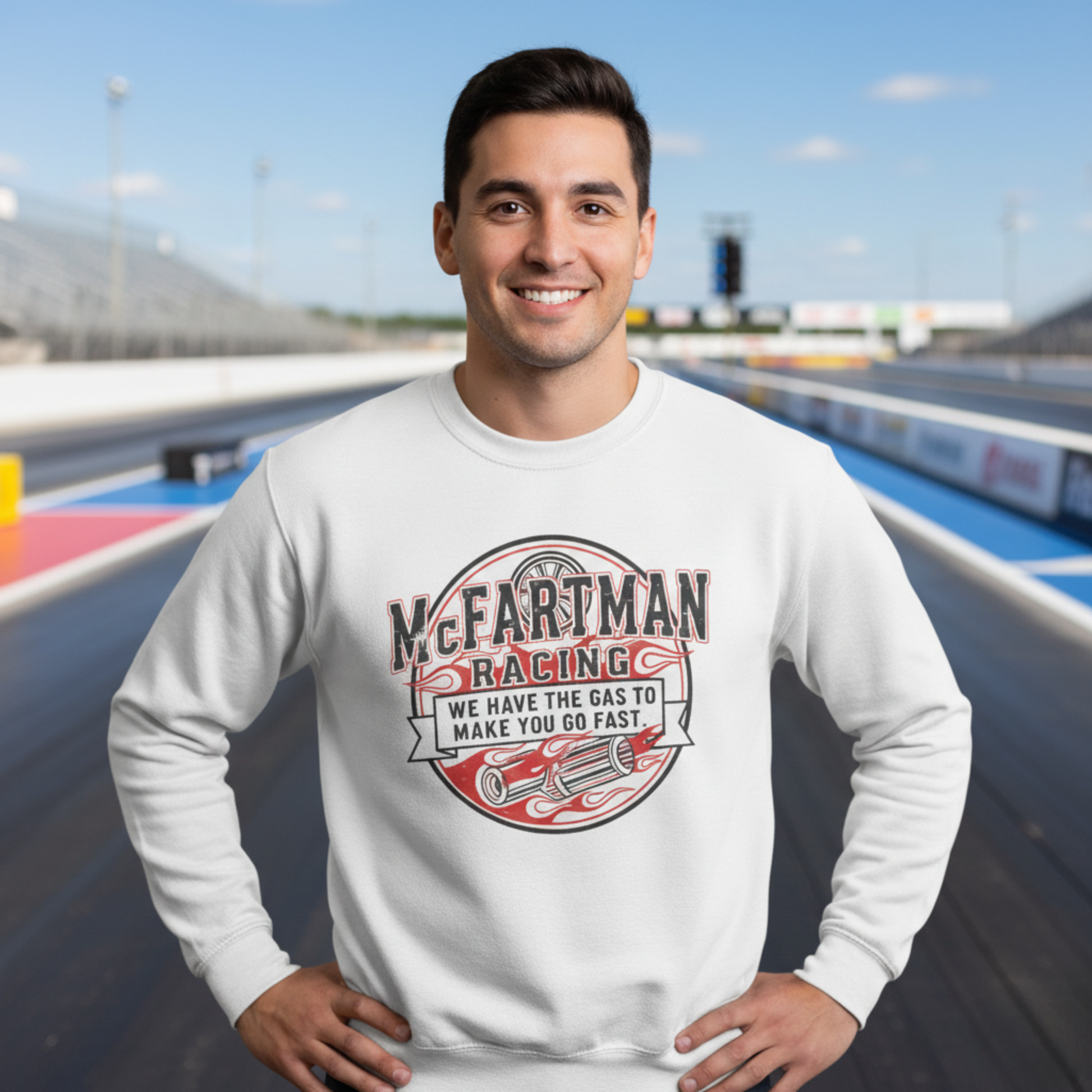 Man wearing a white sweatshirt with 'McFartman Racing' design on a race track background