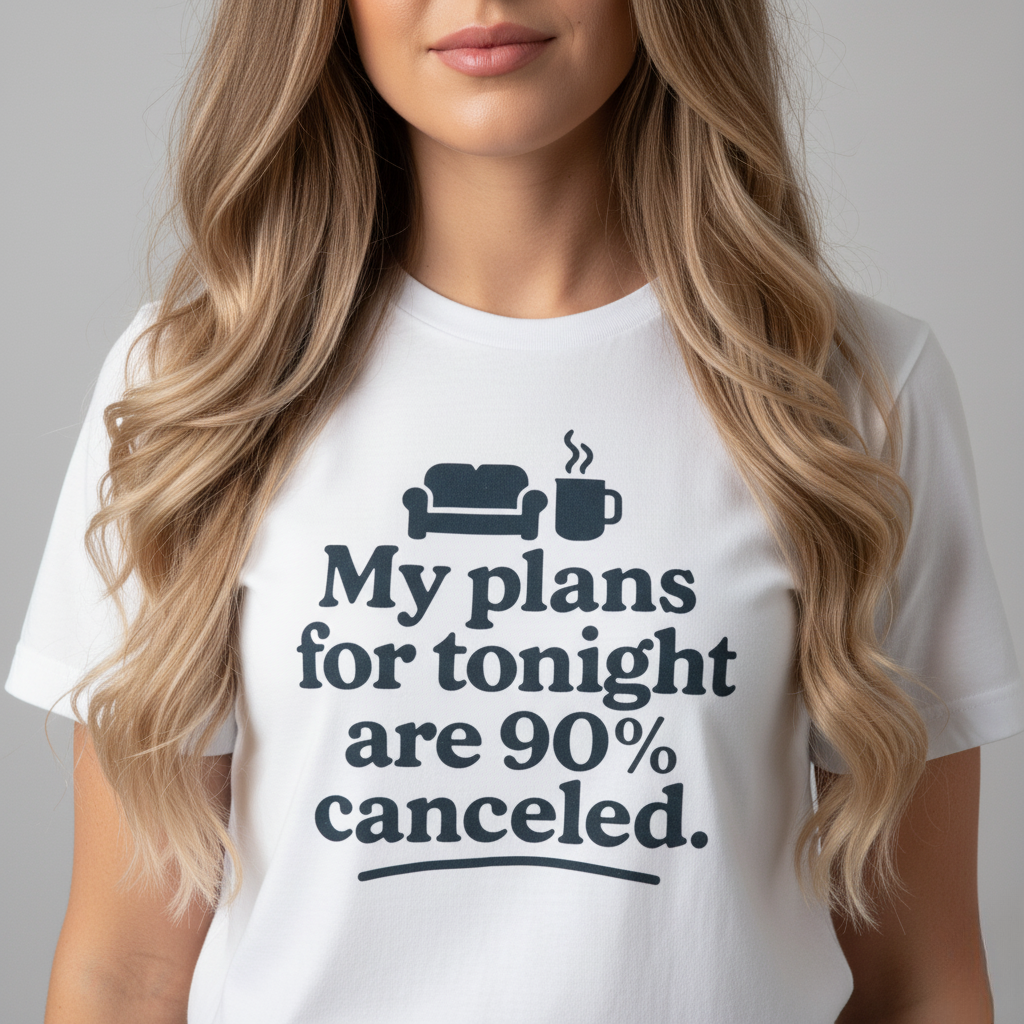 Person wearing a white t-shirt with a humorous text 'My plans for tonight are 90% canceled' design on a plain background