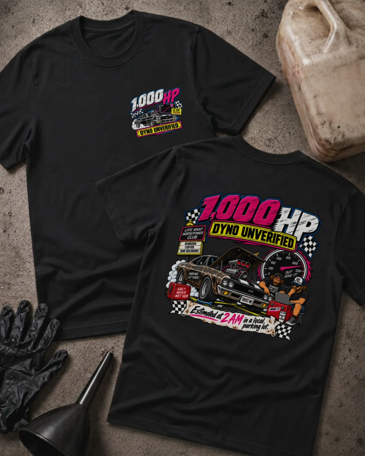 Front and back of 1,000 HP Dyno Unverified black T-shirt with chest logo, muscle car with open hood, tachometer, and “Estimated at 2 AM in a local parking lot” slogan.