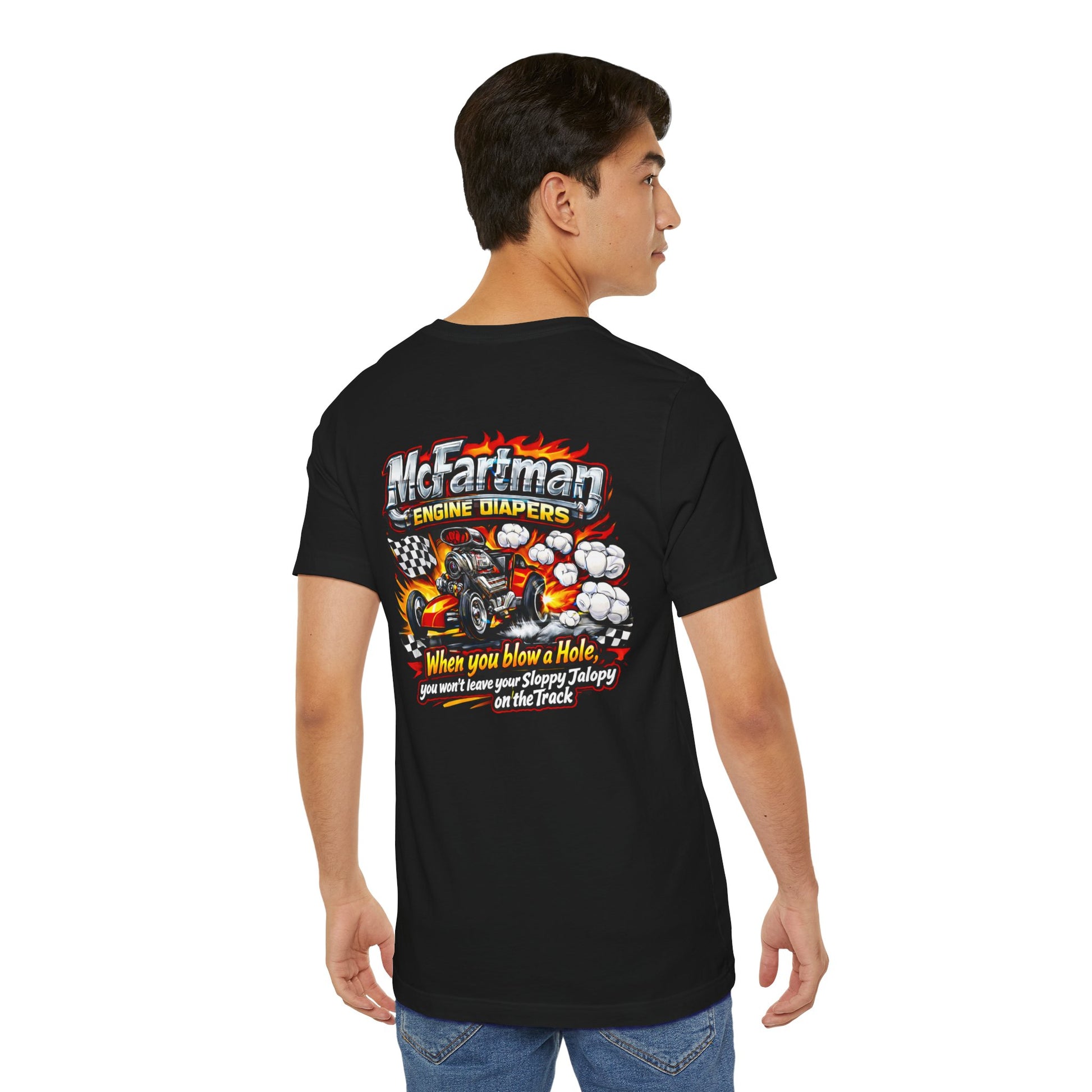 Person wearing a black t-shirt with colorful graphics and 'McFartman Engine Diapers When you blow a Hole, you won't leave your Sloppy Jalopy on the Track' text on the back