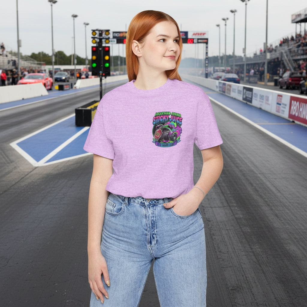 Person wearing a purple t-shirt with a colorful graphic design and text 'Jackstand Jemima Sticky Juice' on a drag strip background