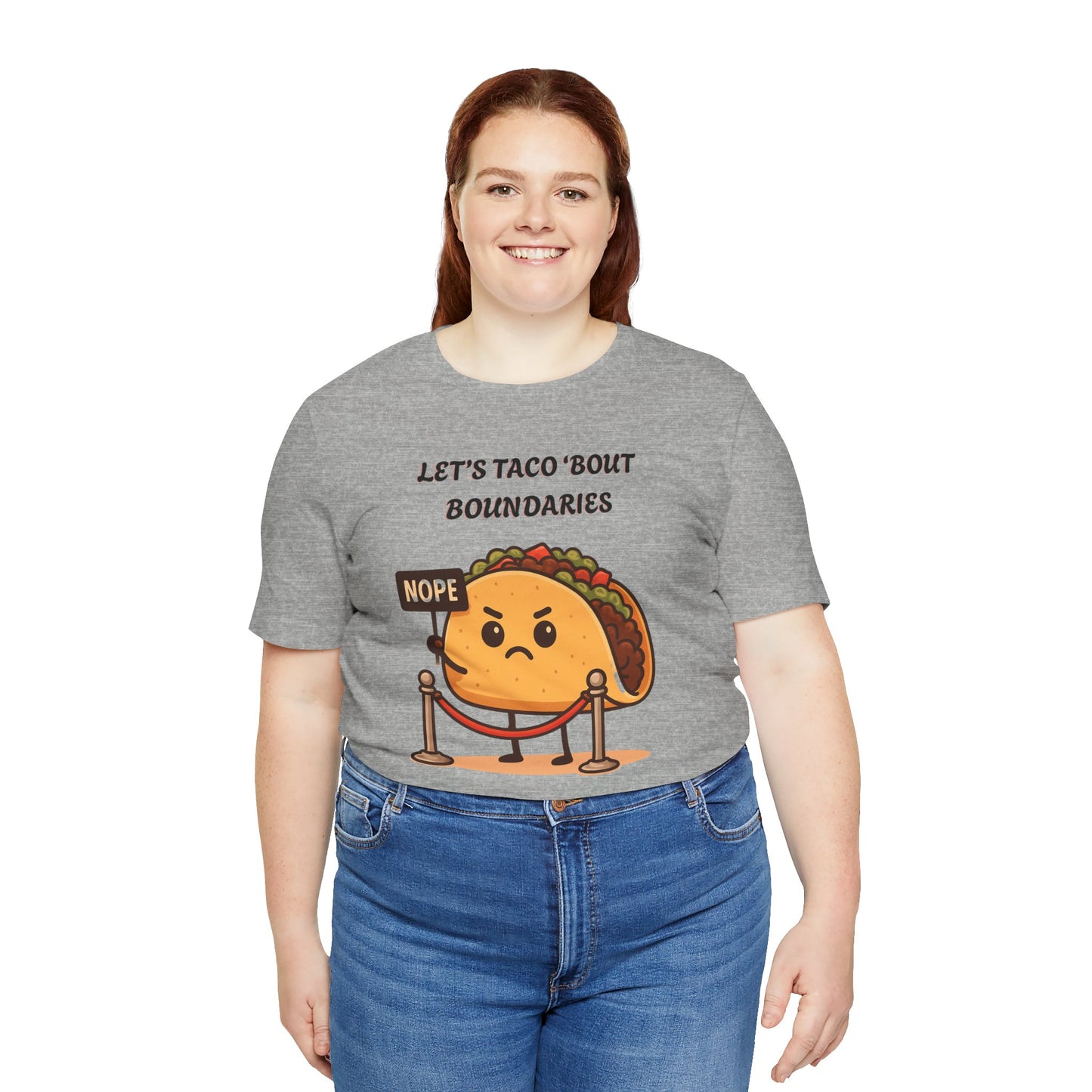 Person wearing a gray t-shirt with a taco graphic and text 'Let's taco 'bout boundaries', on a white background