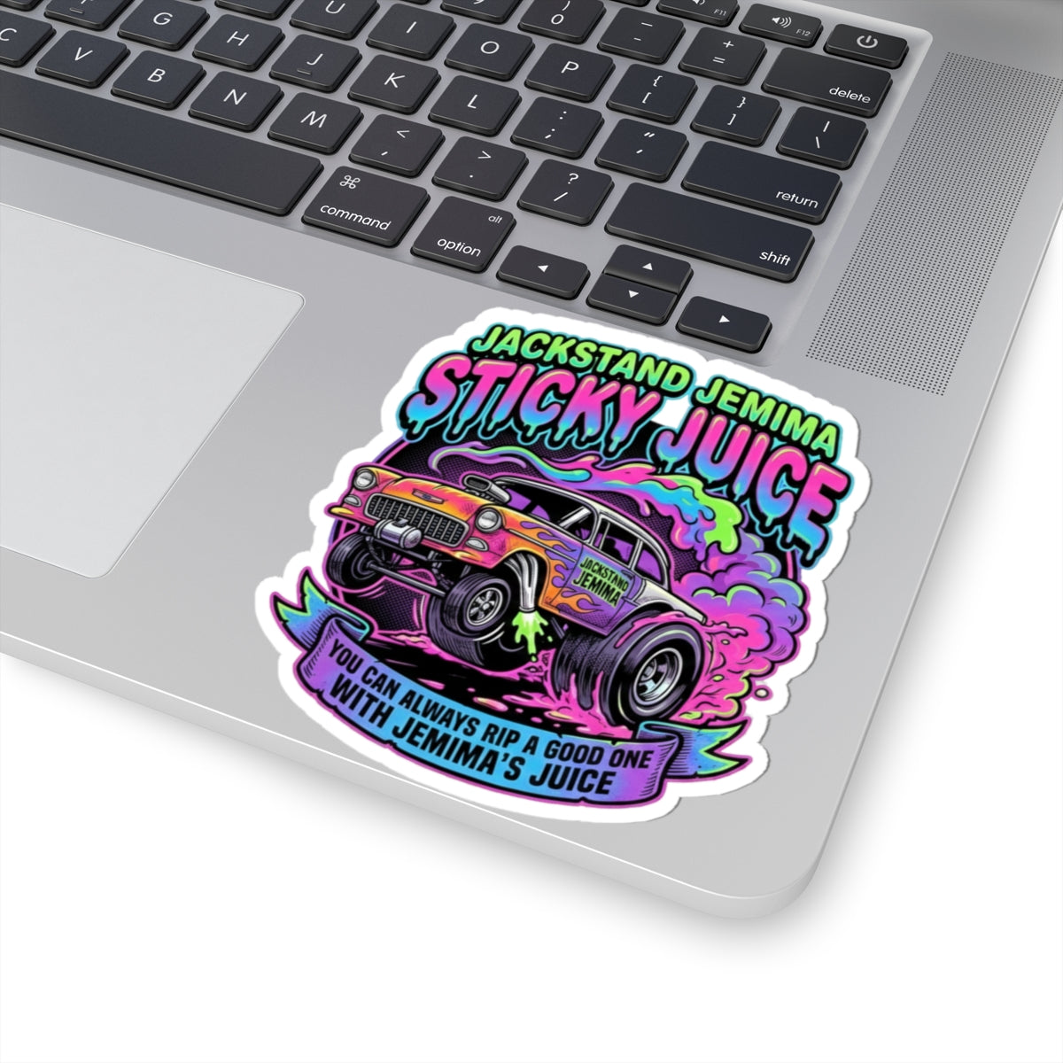 Colorful 'Sticky Juice' sticker on a laptop
