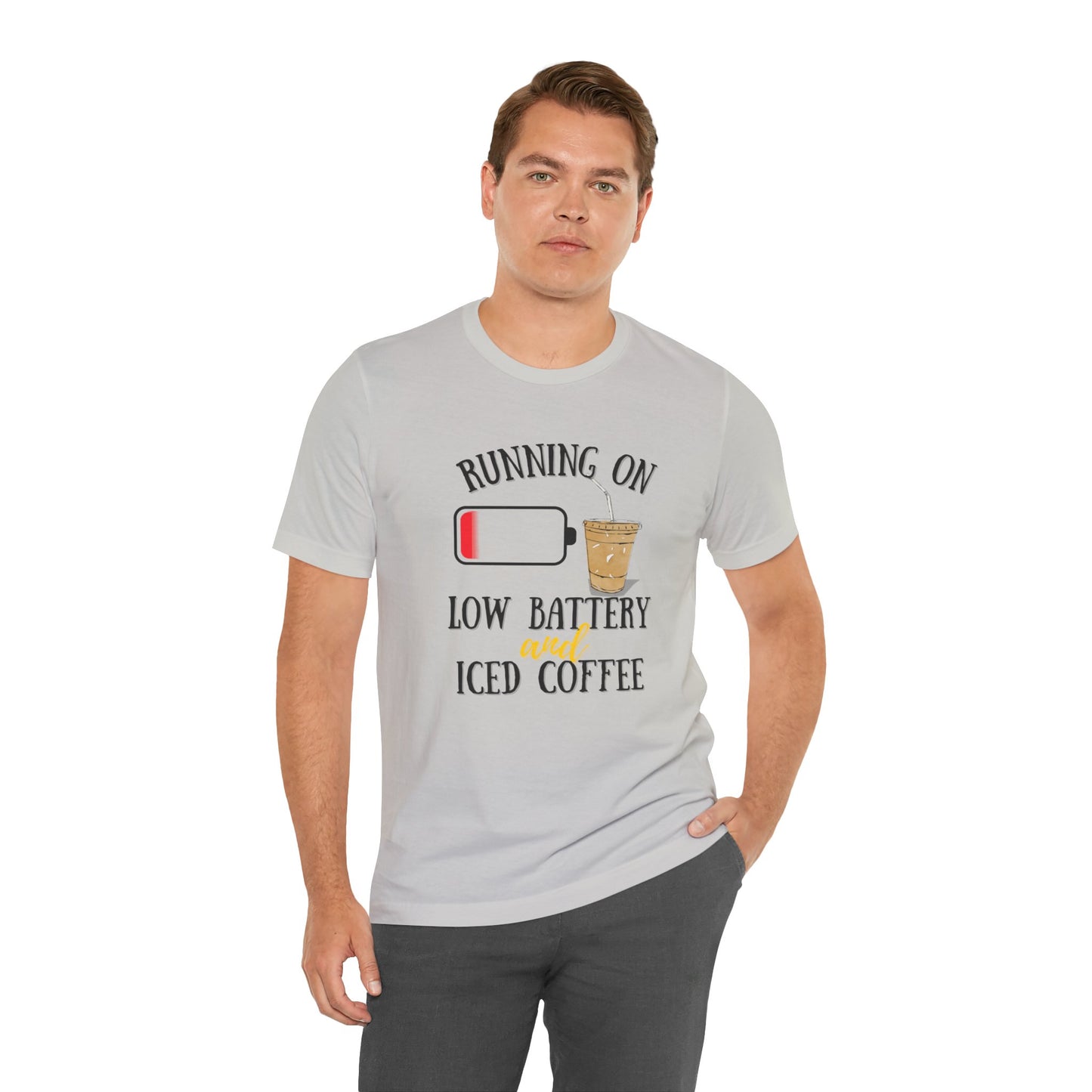 Man wearing a gray t-shirt with a coffee-themed graphic and text 'Running on low battery and iced coffee'.
