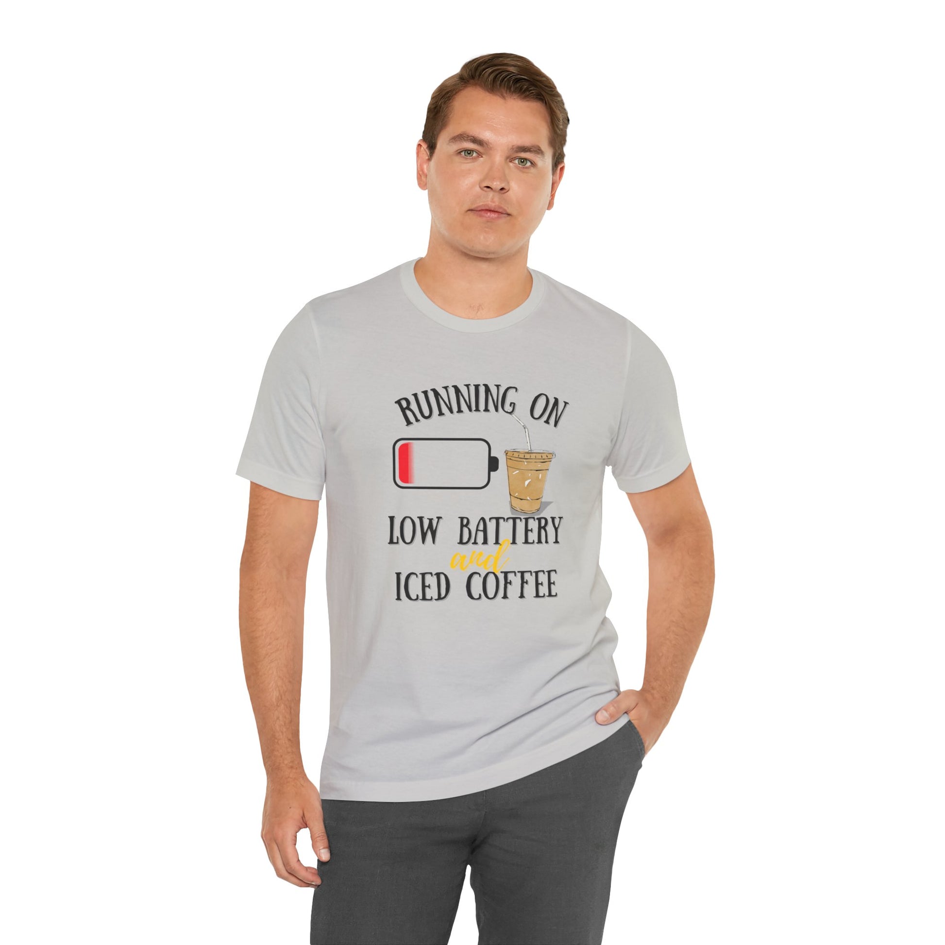 Man wearing a gray t-shirt with a coffee-themed graphic and text 'Running on low battery and iced coffee'.