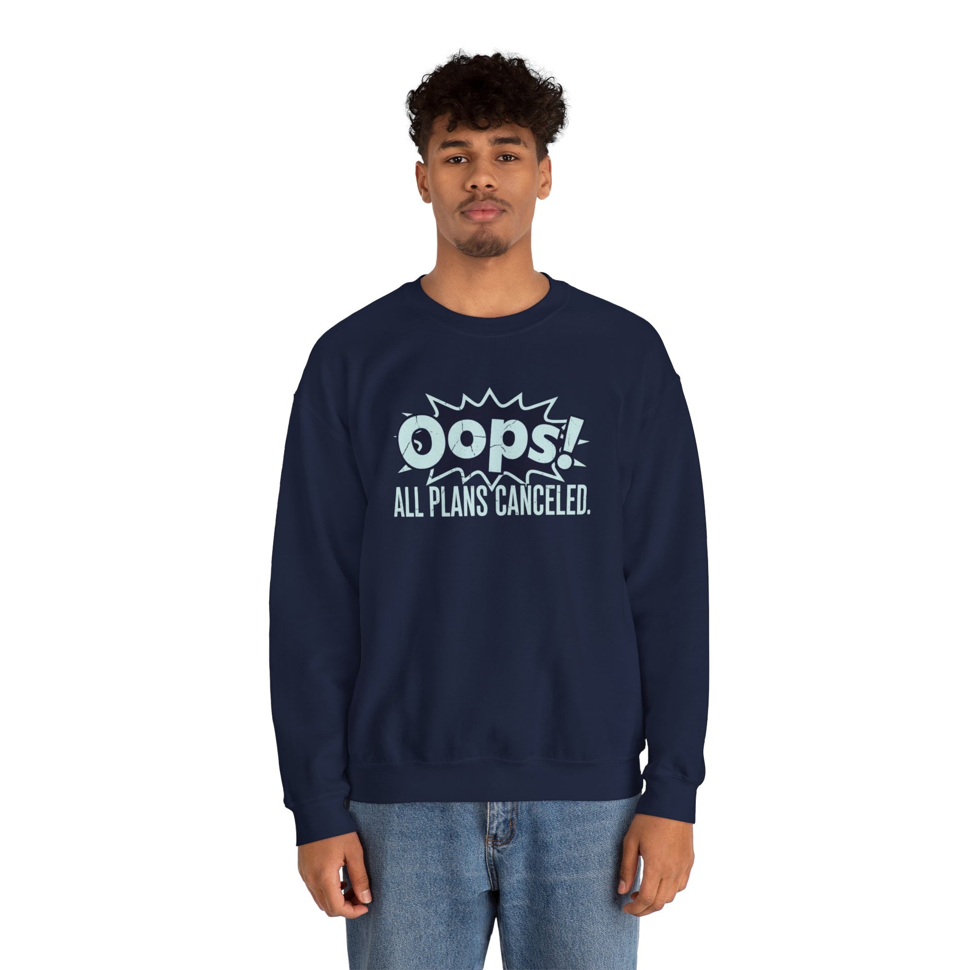 Person wearing a navy sweatshirt with 'Oops! All Plans Canceled' text on a white background