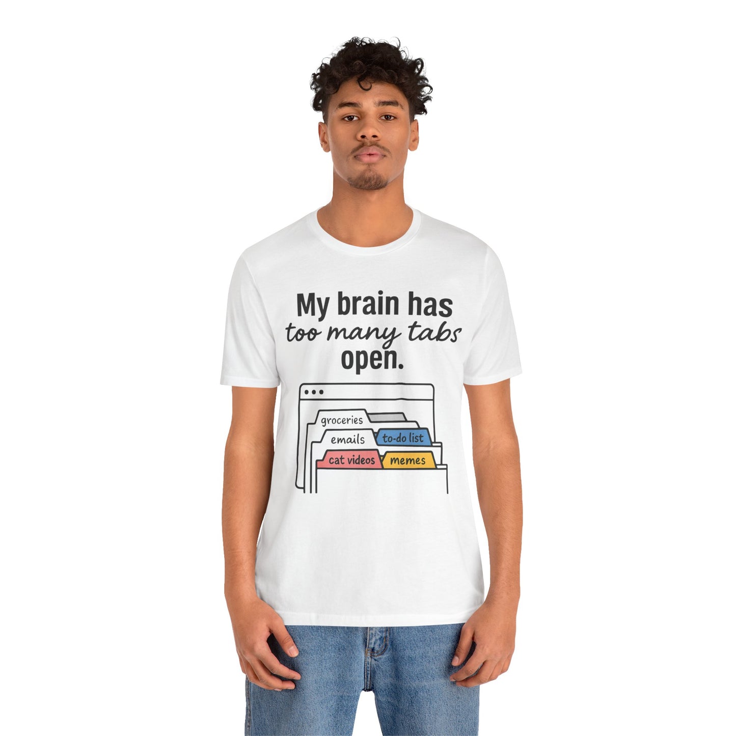 Person wearing a white t-shirt with text 'My brain has too many tabs open' and graphics on a white background