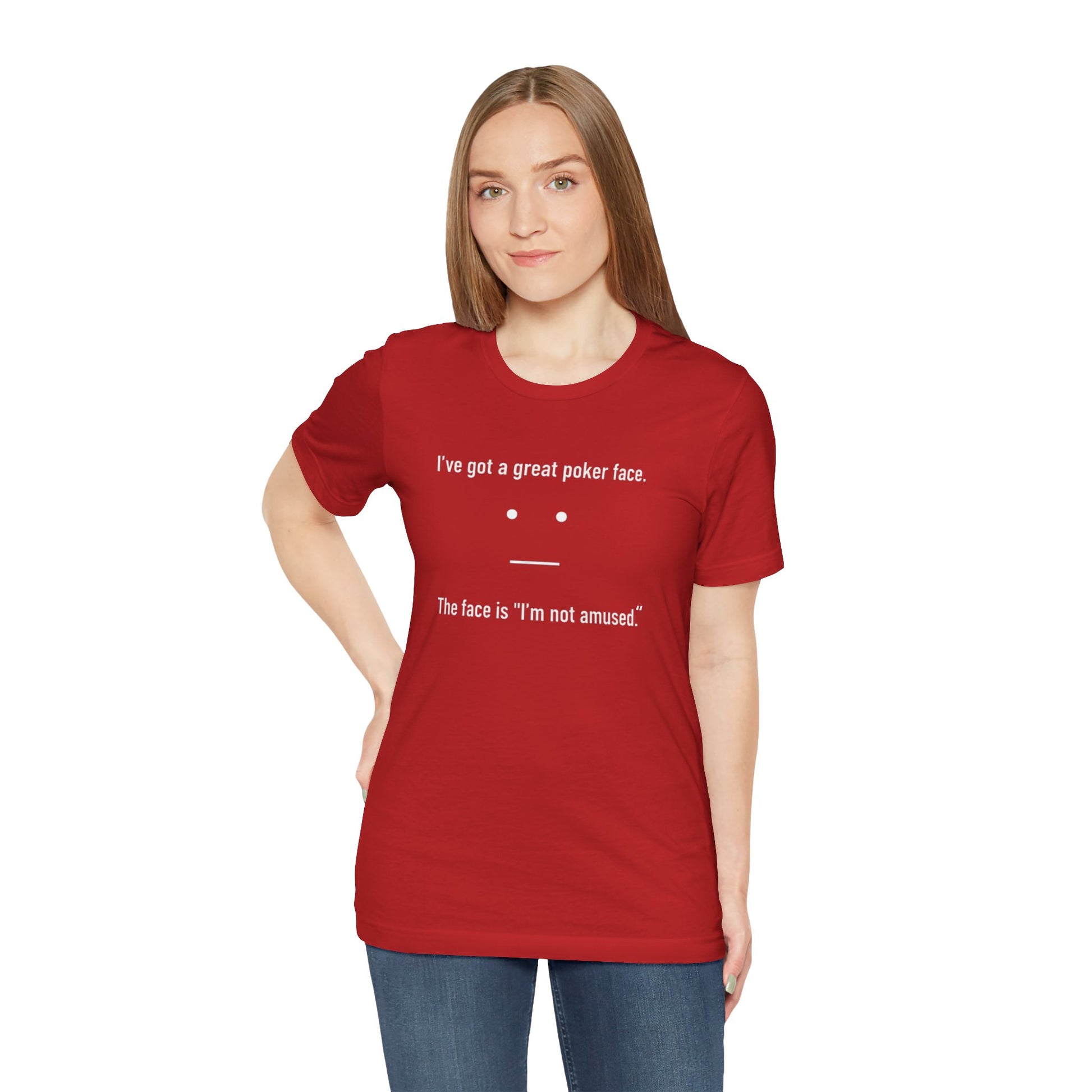 Person wearing a red t-shirt with text 'I've got a great poker face. The face is I'm not amused.' and a face graphic on a white background