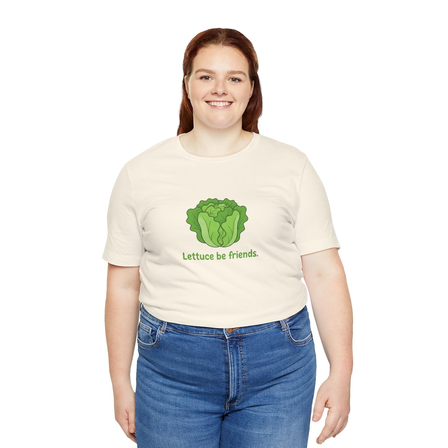 Person wearing a cream t-shirt with a lettuce graphic and text 'Lettuce be friends' on a white background