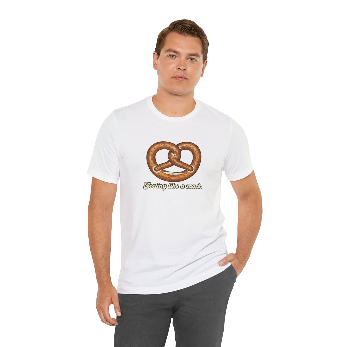 Man wearing a white t-shirt with a pretzel graphic and text 'Feeling like a snack' on a white background
