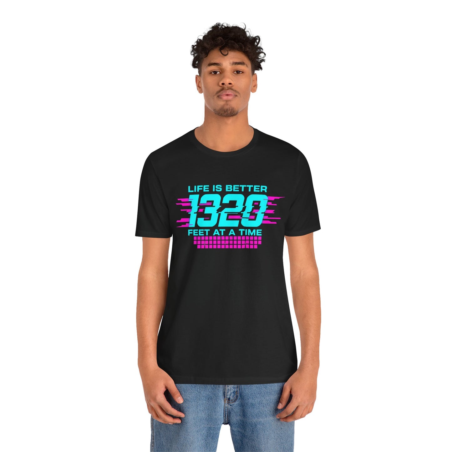 Person wearing a black t-shirt with colorful text 'Life is better 1320 feet at a time' design on a white background