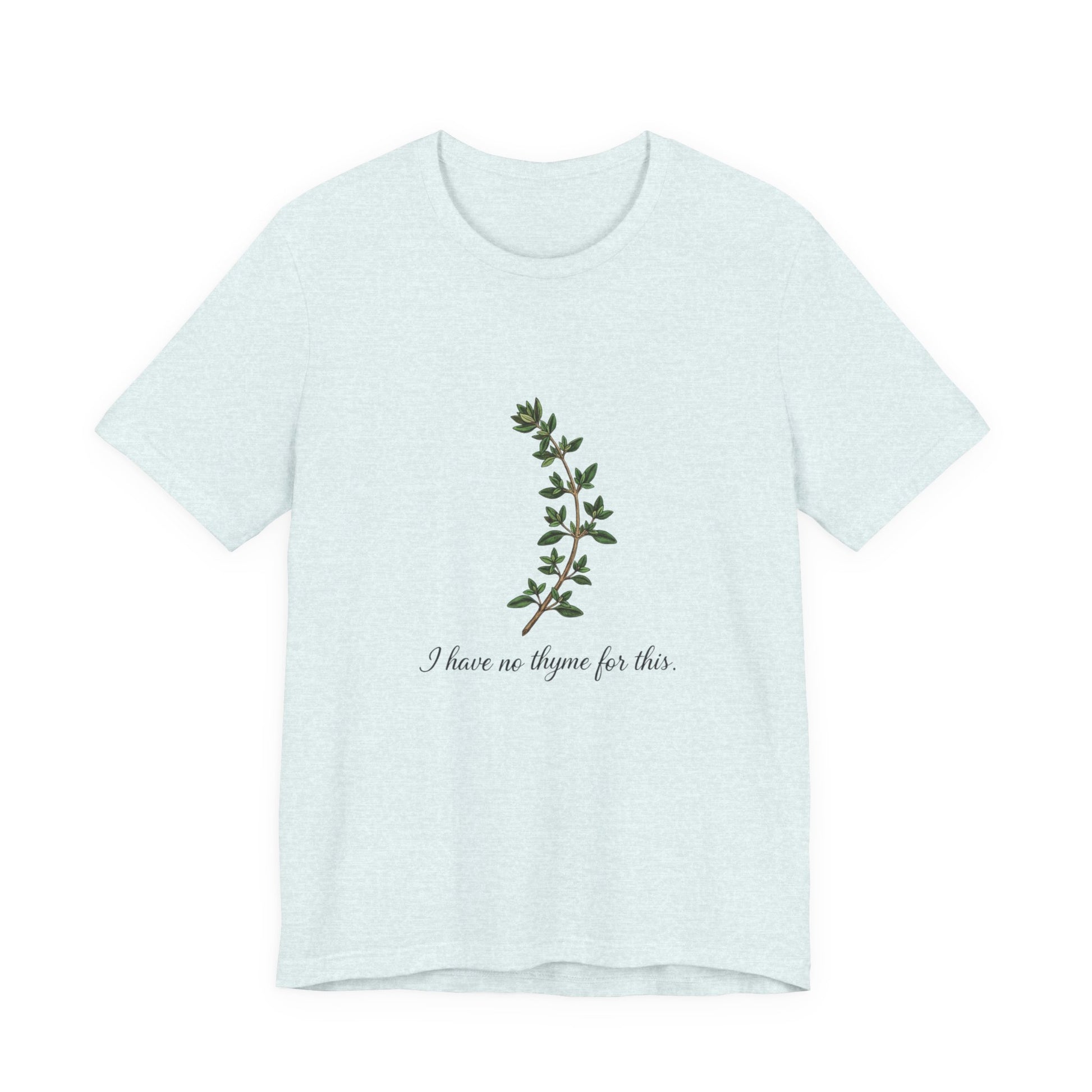 Light blue t-shirt with green leaf design and text 'I have no thyme for this' on a white background