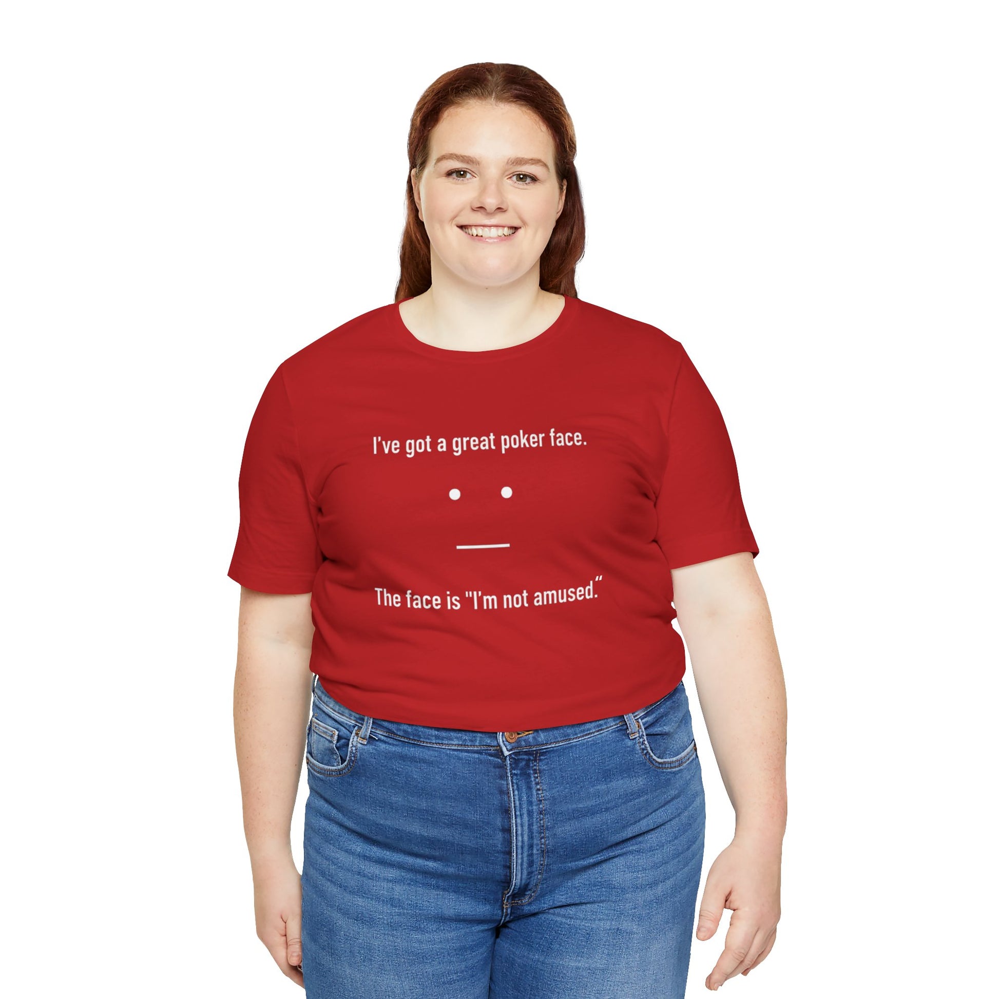 Person wearing a red t-shirt with text 'I've got a great poker face. The face is I'm not amused.' and a face graphic on a white background