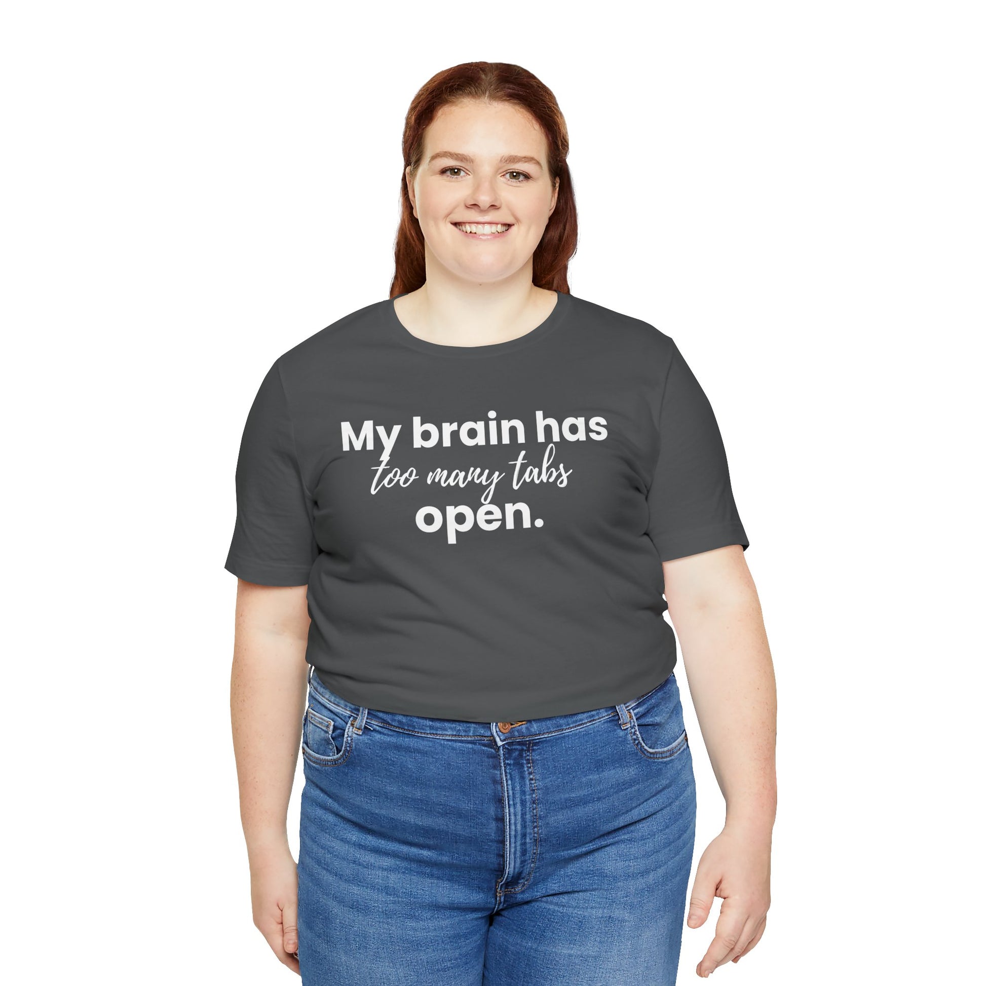Person wearing a dark gray t-shirt with 'My brain has too many tabs open' text on a white background