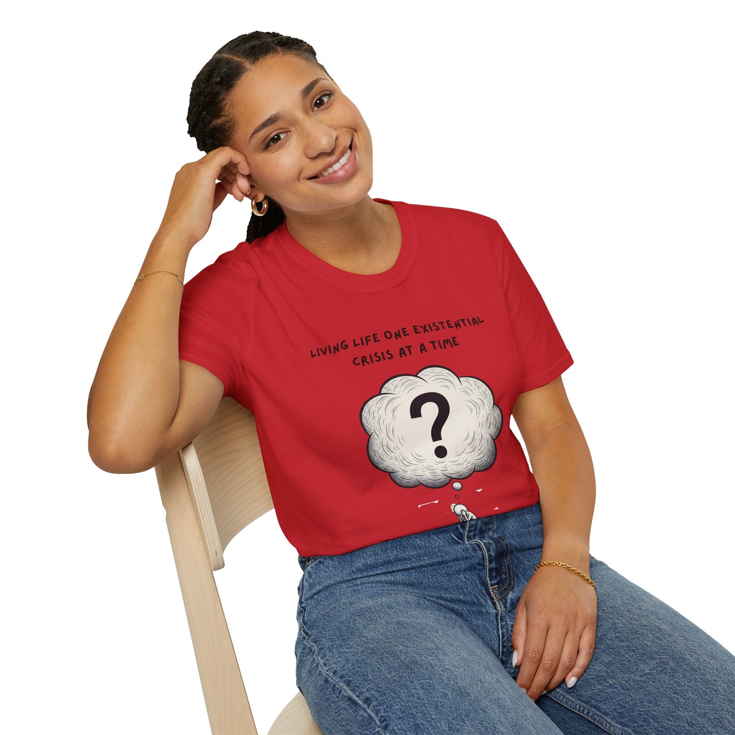 Person wearing a red t-shirt with a graphic and text 'Living Life One Existential Crisis At A Time', sitting on a white background