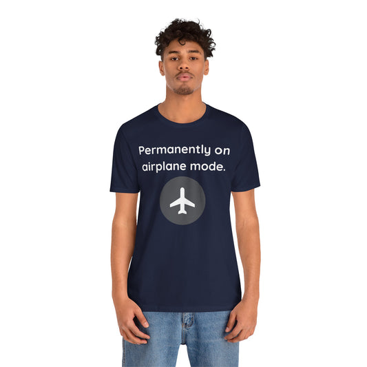Person wearing a navy blue t-shirt with airplane mode graphic and text 'Permanently on airplane mode' on a white background