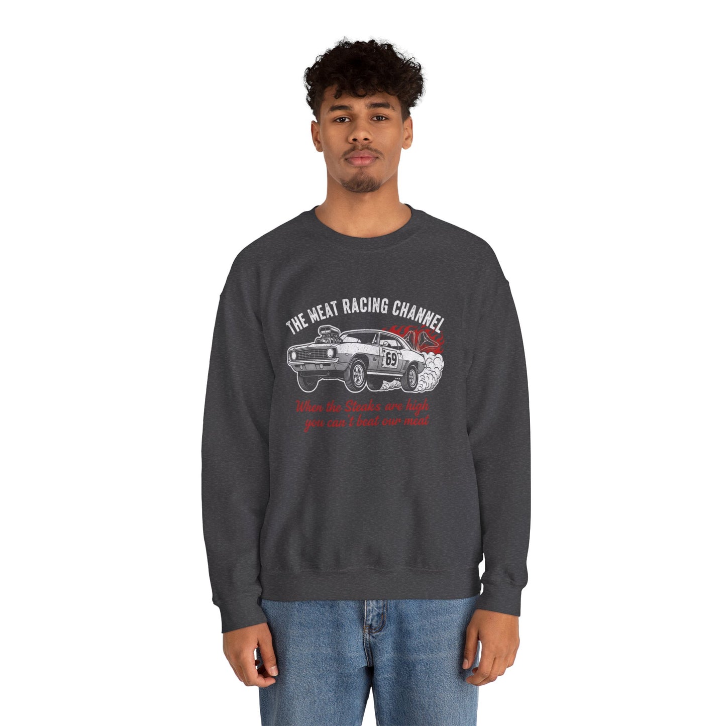 Person wearing a dark gray sweatshirt with a car graphic and text 'The Meat Racing Channel When the Steaks are high you can't beat our meat' on a white background