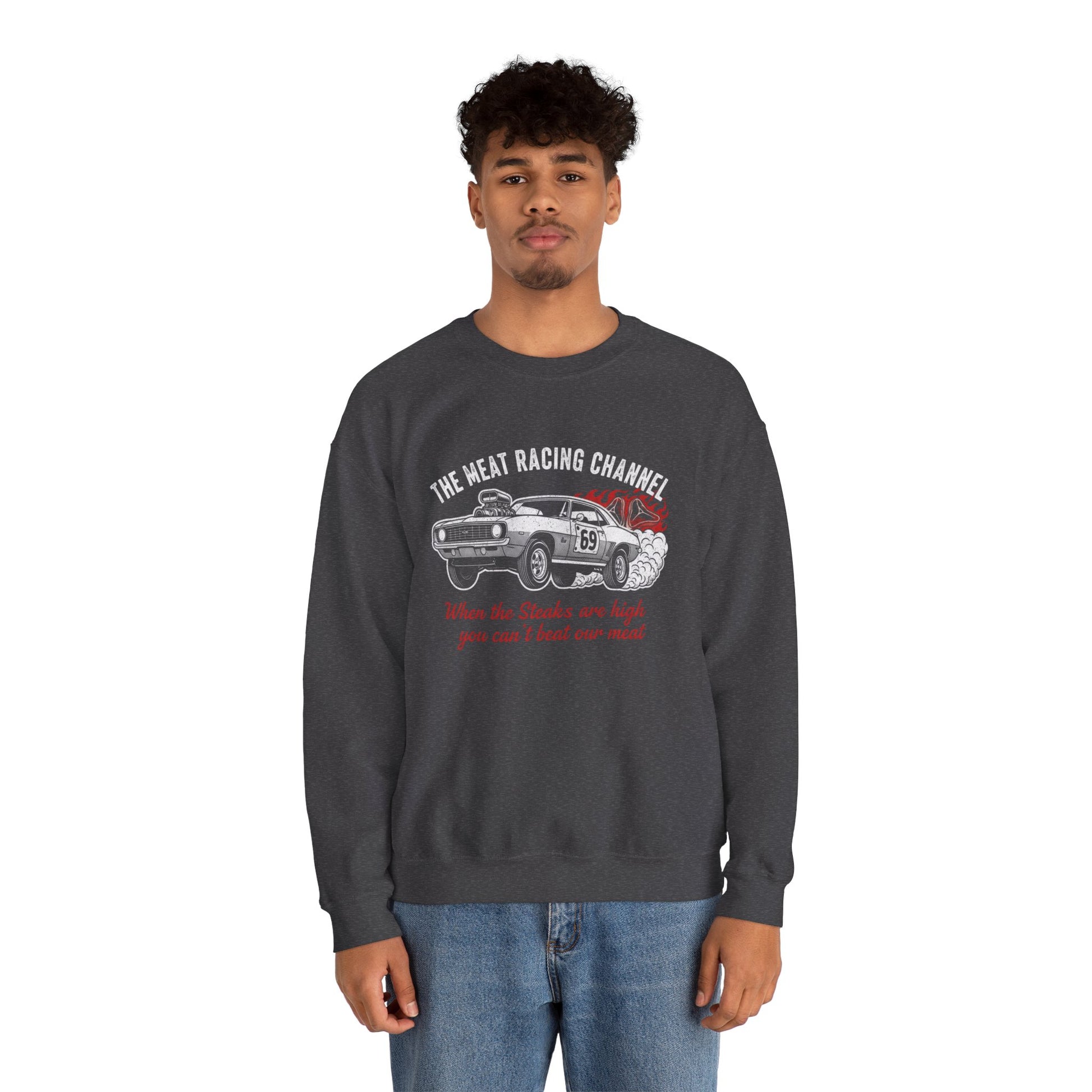 Person wearing a dark gray sweatshirt with a car graphic and text 'The Meat Racing Channel When the Steaks are high you can't beat our meat' on a white background
