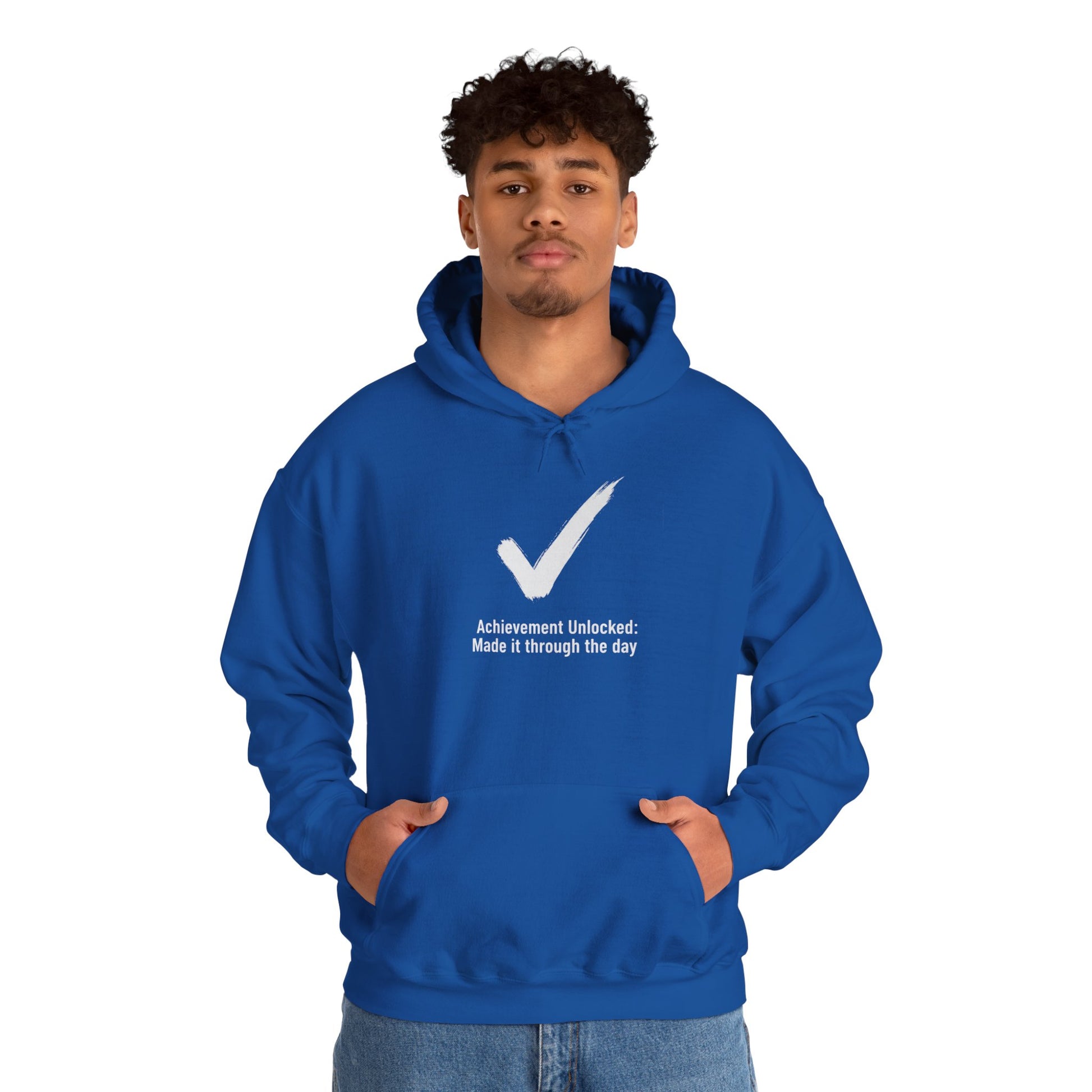 Person wearing a blue hoodie with a white checkmark and text 'Achievement Unlocked: Made it through the day' on a white background