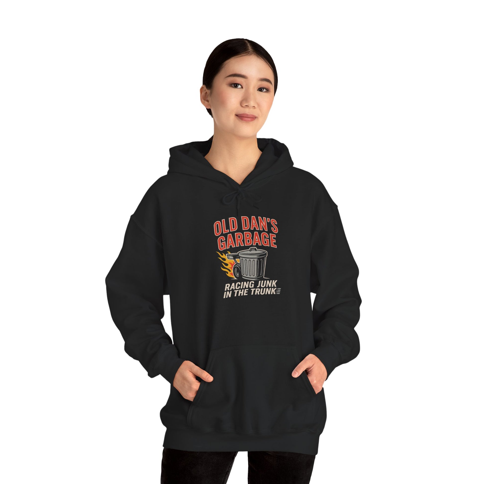 Person wearing a black hoodie with 'Old Dan's Garage' graphic design on a white background