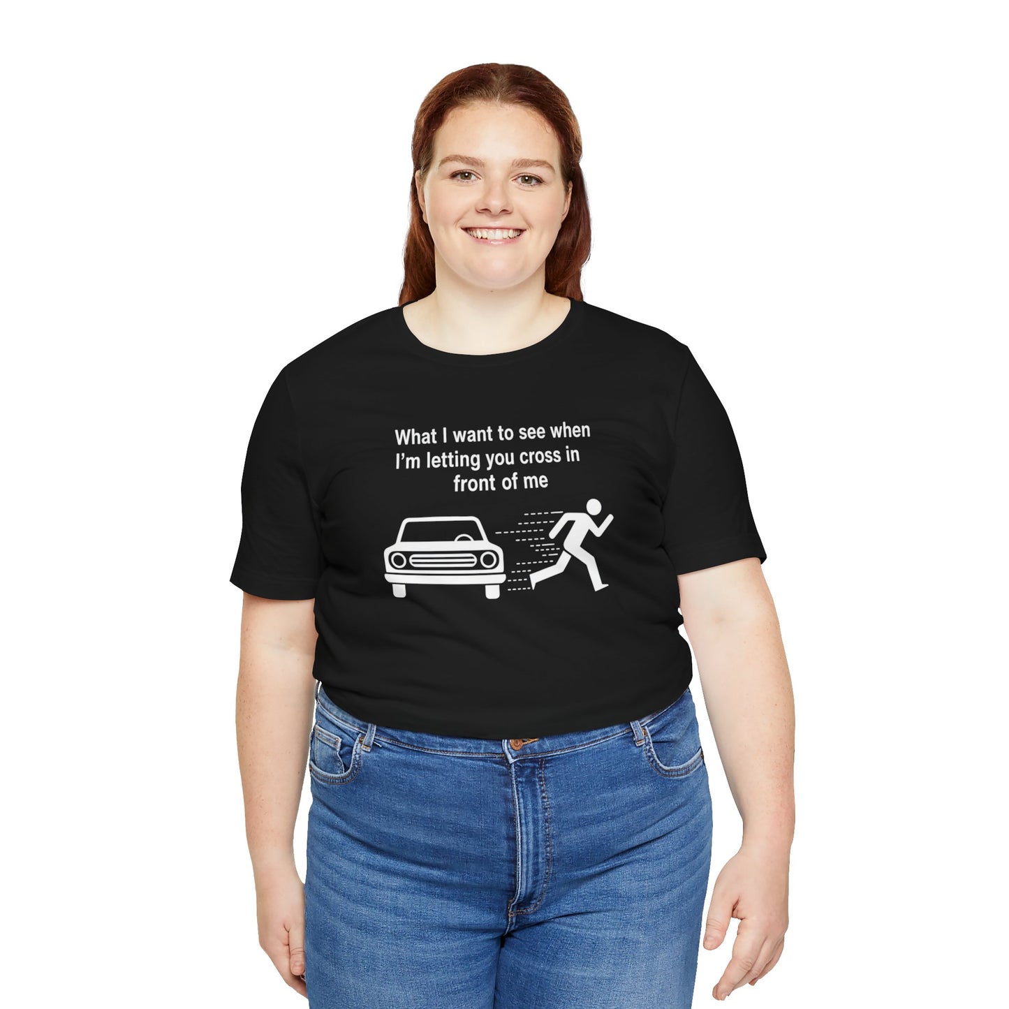 Person wearing a black t-shirt with a graphic and text 'What I want to see when I'm letting you cross in front of me' on a white background