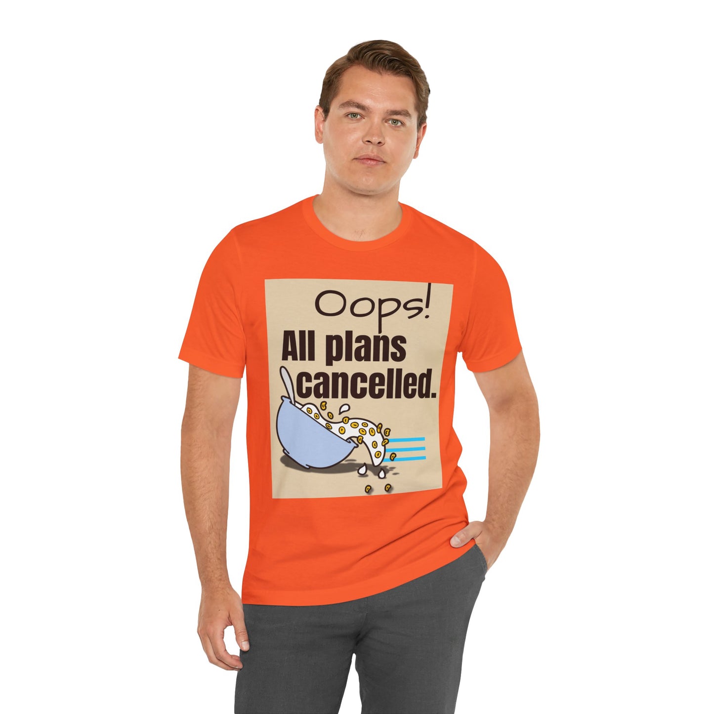 Man wearing an orange t-shirt with a graphic and text 'Oops! All plans cancelled.'