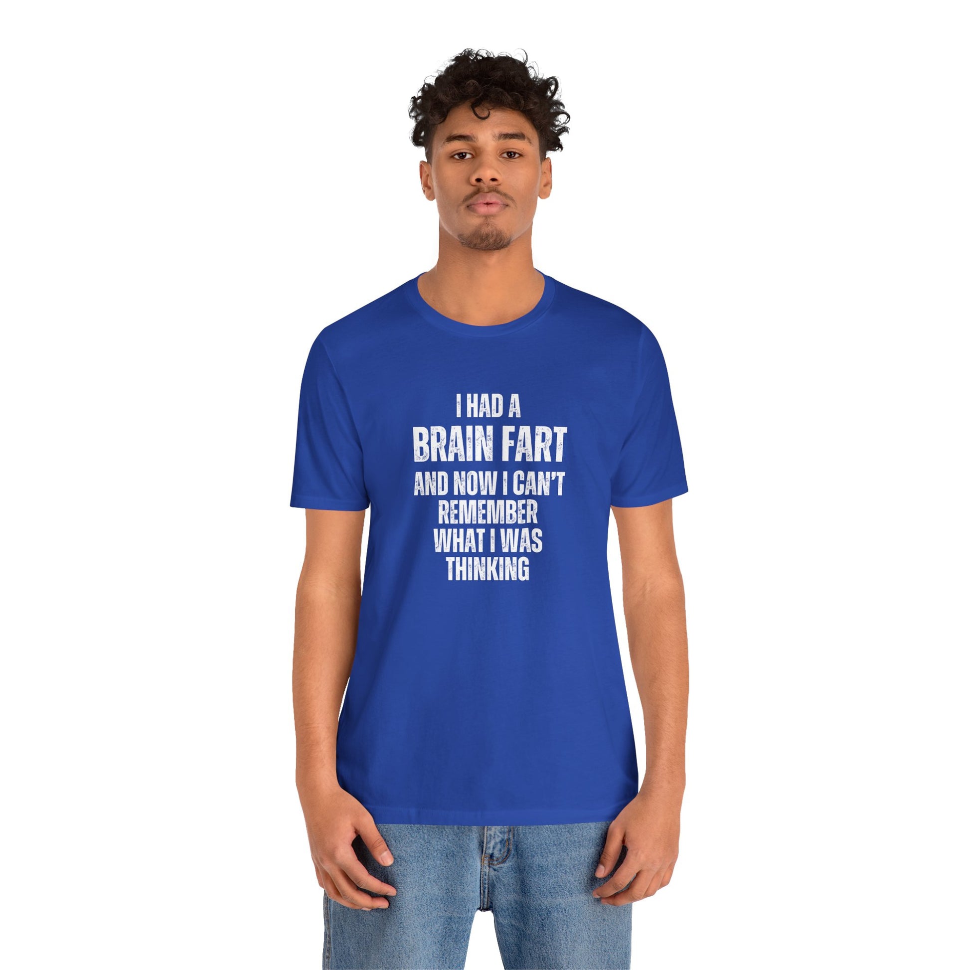 Person wearing a blue t-shirt with humorous text 'I had a brain fart and now I can't remember what I was thinking' on a white background