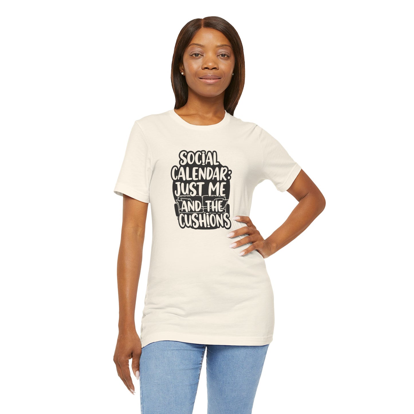 Woman wearing a white t-shirt with text 'Social calendar: Just me and the cushions' design on a white background